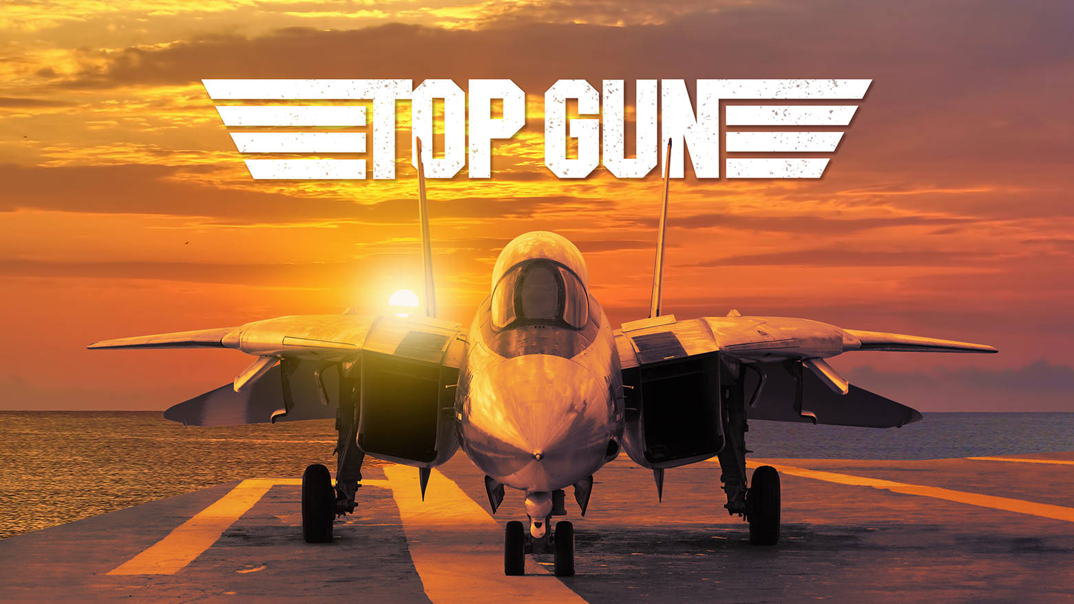 日落時航空母艦甲板上的戰鬥機和Top Gun標誌。 — 捍衛戰士：獨行俠 壁紙