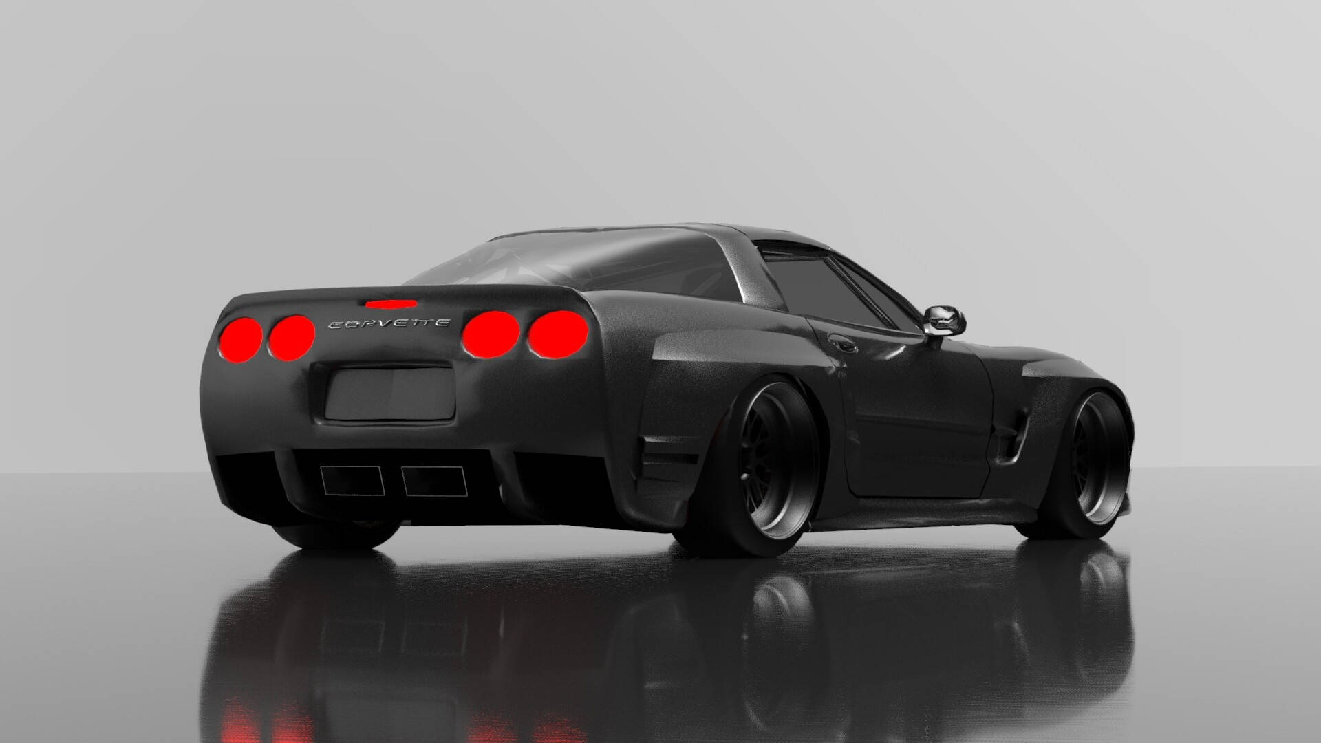 corvette 桌布 壁紙 — 一架時尚的啞光黑色Corvette跑車，帶有發光的紅色尾燈，停在反射的攝影棚地板上，背景是純灰色。