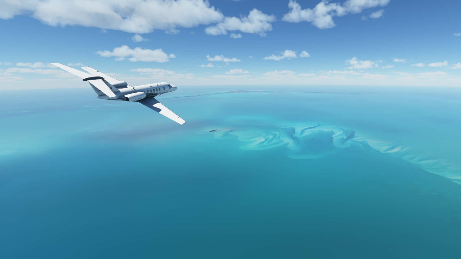 1920x1080 Microsoft Flight Simulator 桌布 壁紙 — 一架時尚的白色私人飛機在碧綠的海水上翱翔，在藍天白雲下顯露出一個隱藏的環礁。