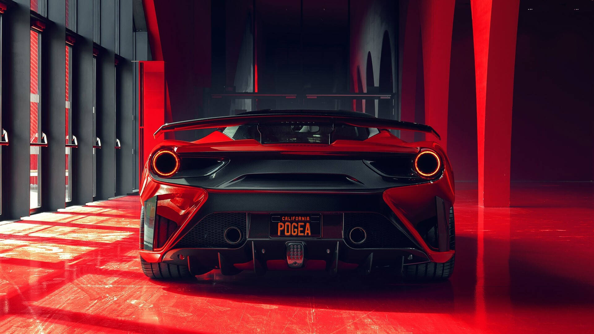 1920x1080 Ferrari 桌布 壁紙 — 一架時尚的紅色Pogea跑車從後方展示在一個充滿戲劇性紅色燈光的簡約車庫中。