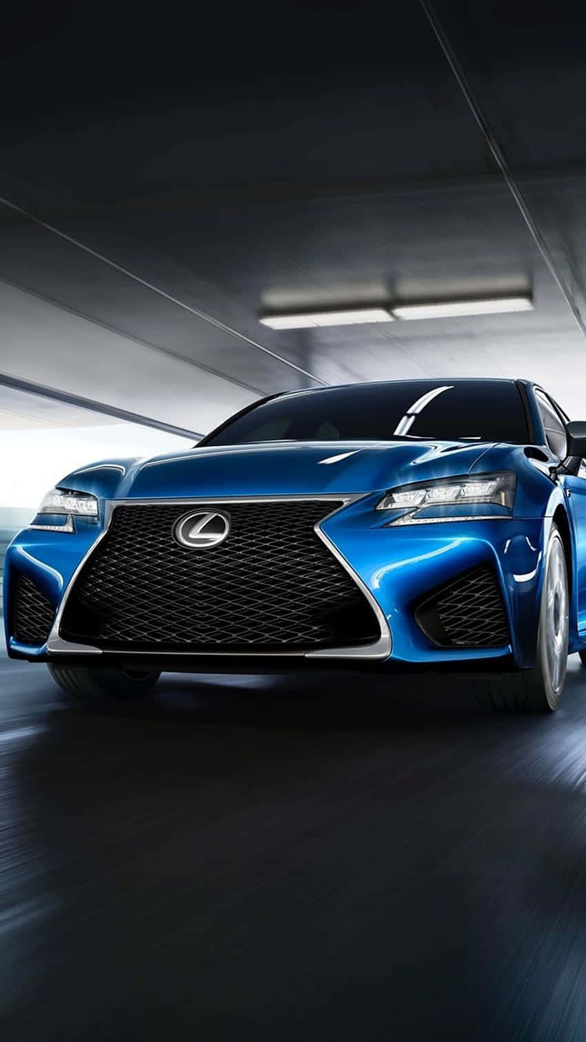 Lexus Gs 桌布 壁紙 — 一架時尚的藍色Lexus跑車在昏暗的隧道中疾馳，路上帶有動態模糊效果。