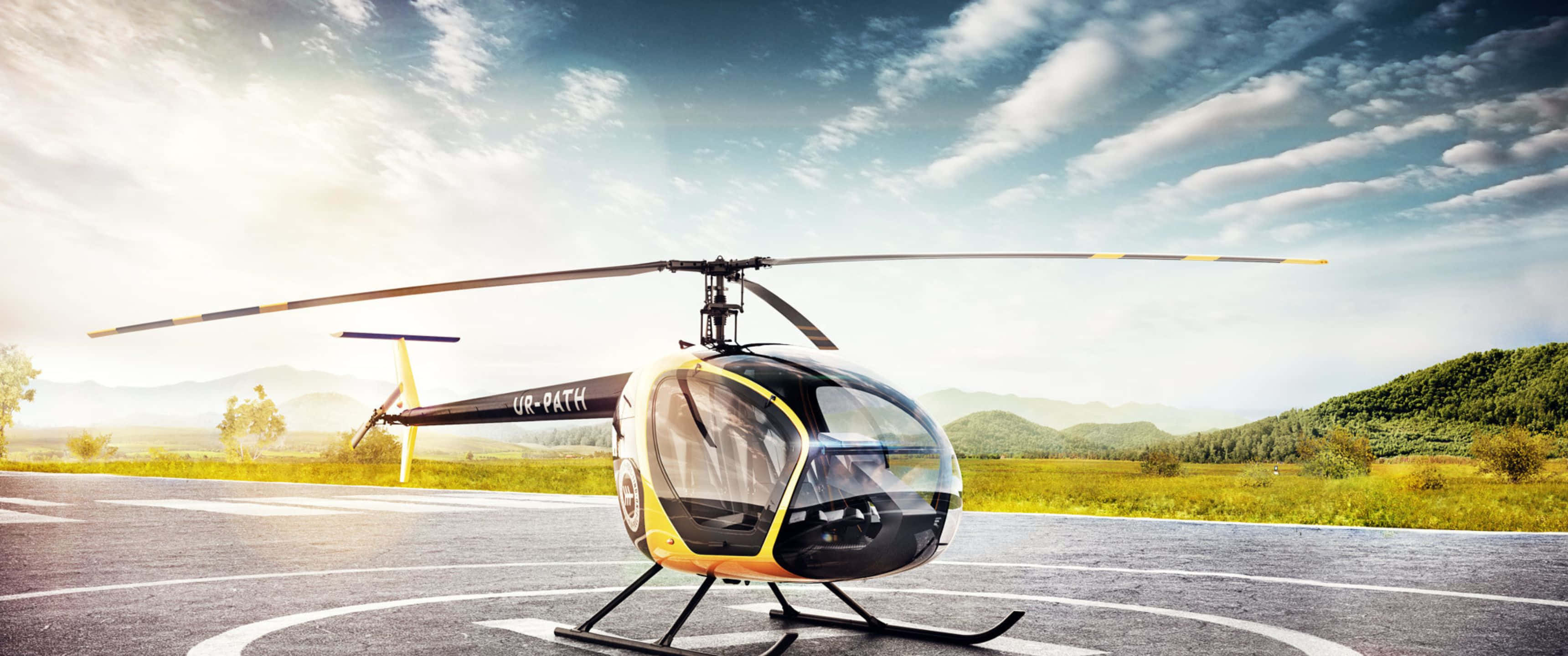 3440x1440p Helicopters 桌布 壁紙 — 一架時尚的黑色和黃色直升機停在鋪砌的直升機停機坪上，背景是起伏的綠色山丘和晴朗的藍天，點綴著幾朵白雲。