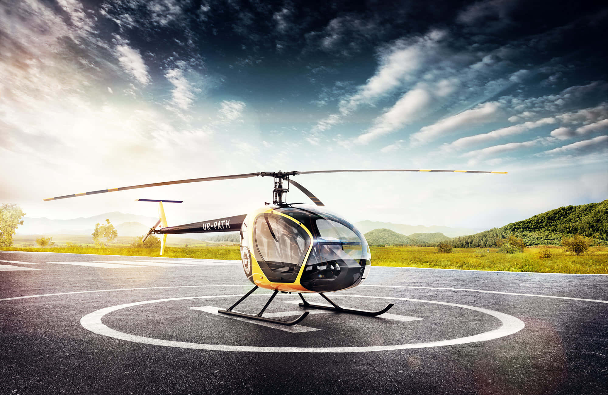 Helicopters 桌布 壁紙 — 一架時尚的黑色和黃色直升機停放在直升機停機坪上，背景是山脈和綠色田野，天空多雲而戲劇化。