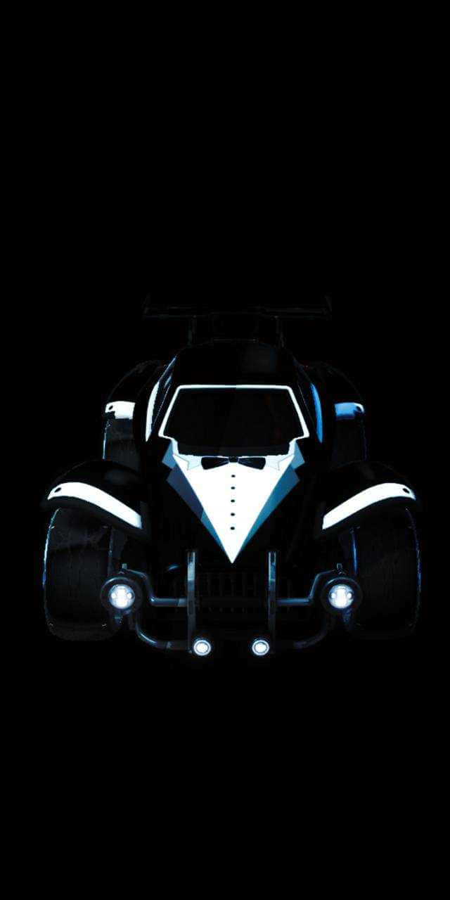 Rocket League Car 桌布 壁紙 — 一架時尚的黑色蝙蝠車，帶有發光的白色飾邊和車頭燈，在漆黑的背景下向前凝視。