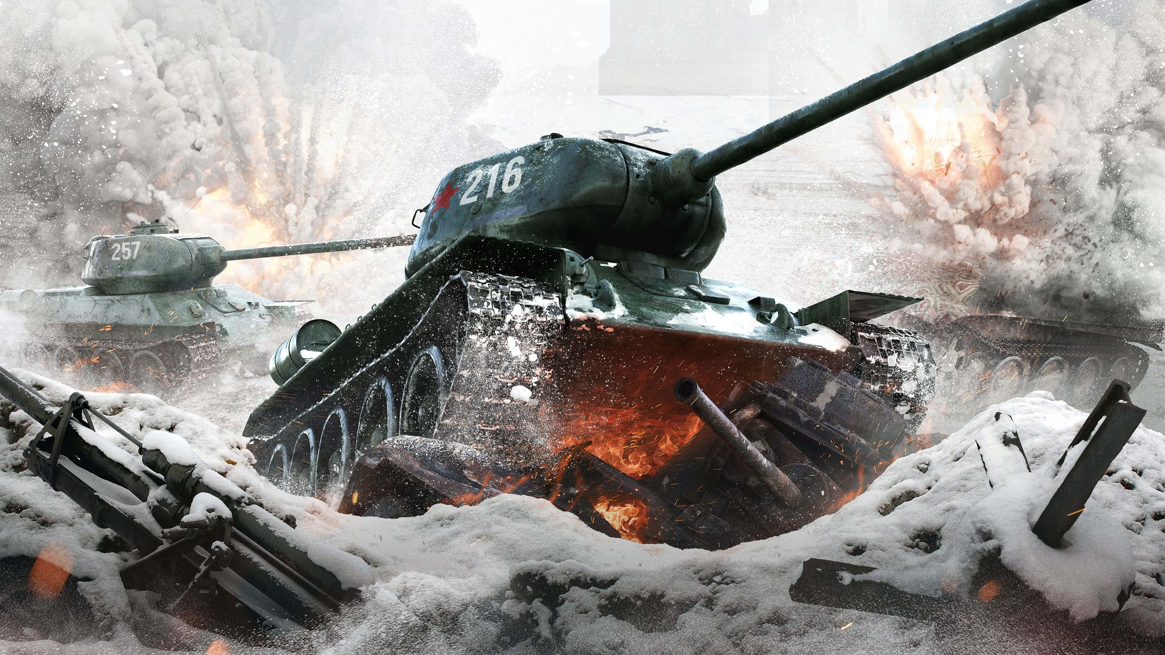 World War 2 桌布 壁紙 — 一架標記為216的燃燒坦克在雪地戰場上衝鋒，爆炸和煙霧瀰漫空氣。