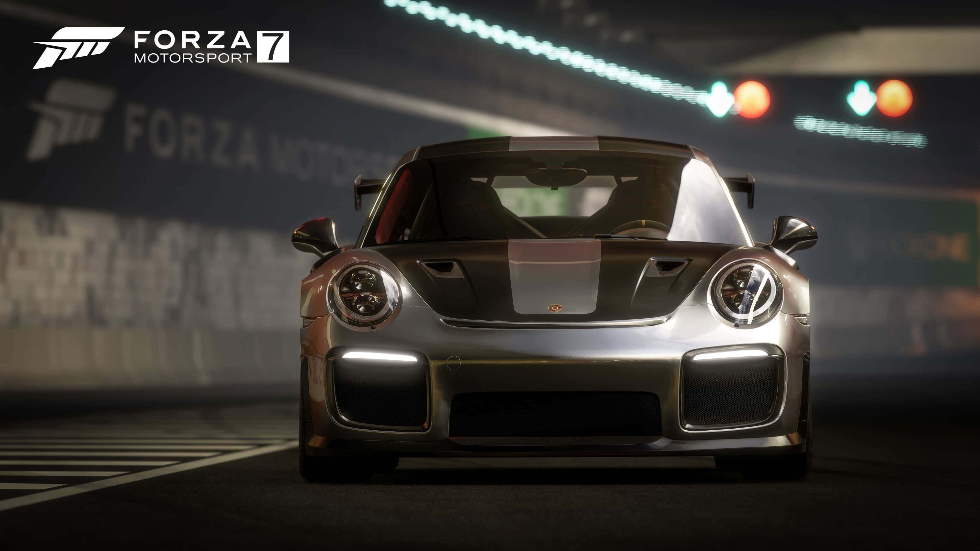 跑車 桌布 壁紙 — 一架流線型銀色保時捷911 GT1在昏暗的隧道中疾馳，背景有發光的賽道燈光和模糊的標誌。