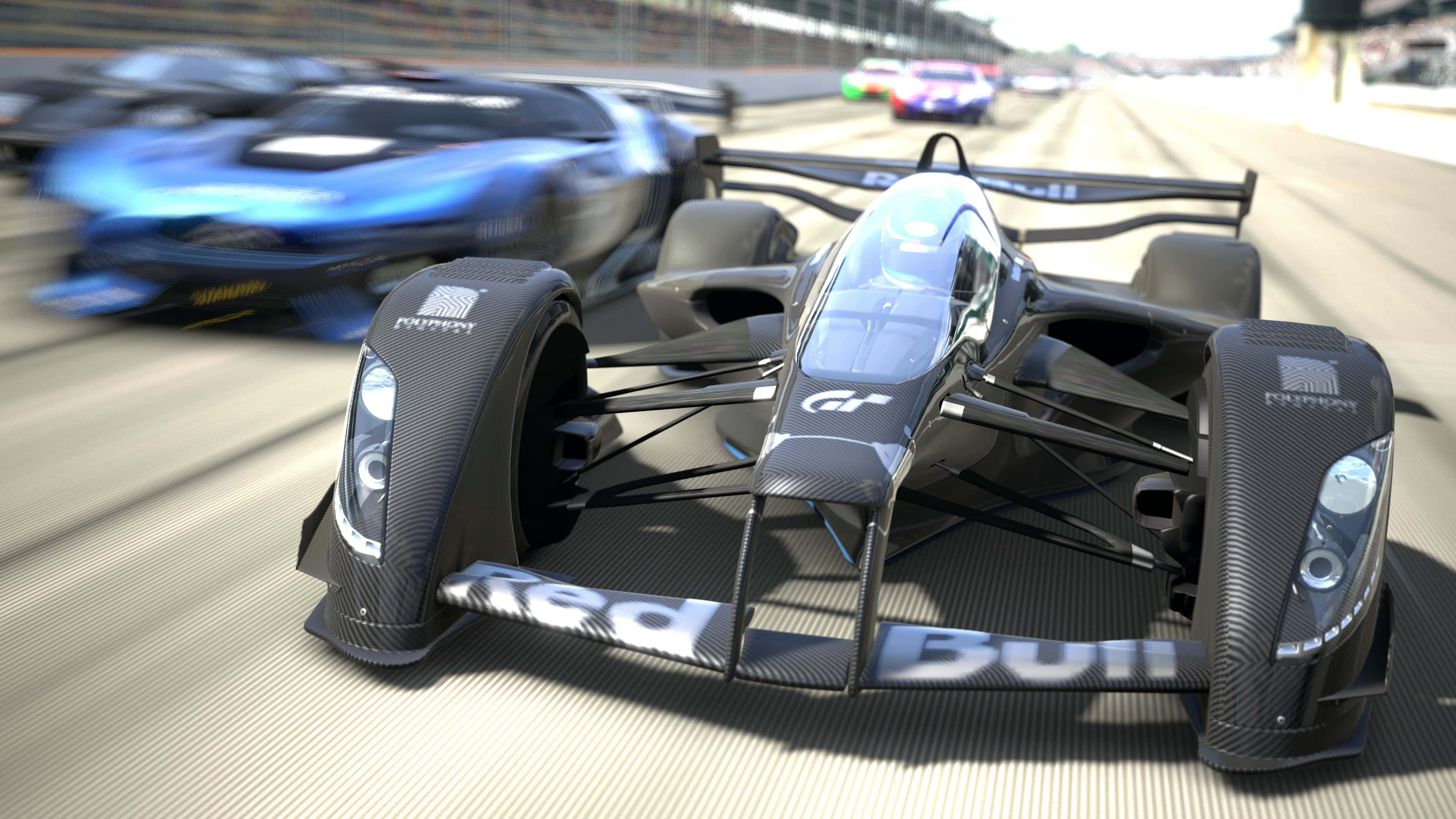 Live Car 桌布 壁紙 — 一架流線型黑色 Formula E 賽車在陽光明媚的賽道上疾馳，背景中有模糊的競爭對手。
