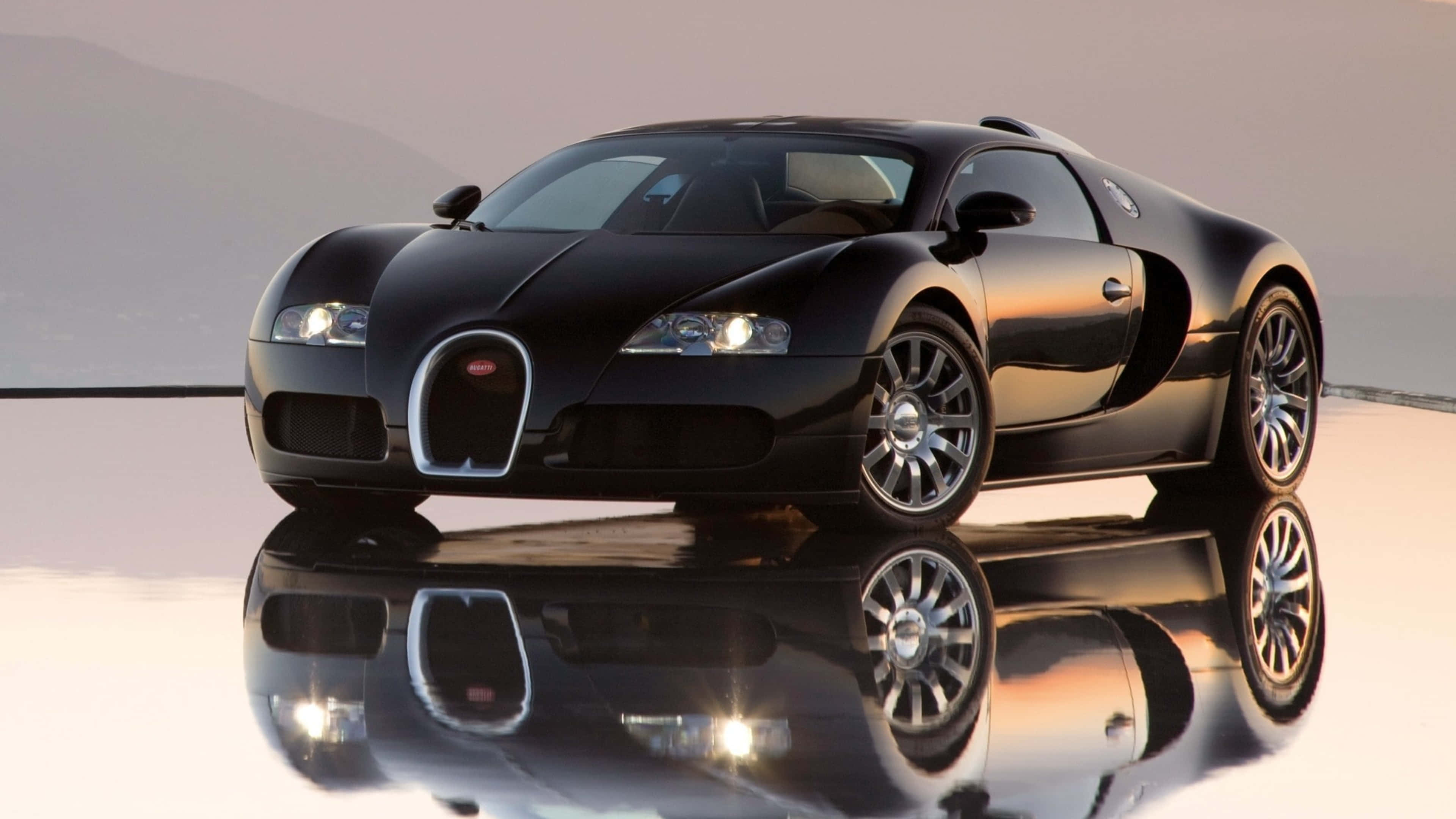 bugatti iPhone 桌布 壁紙 — 一架流線型黑色Bugatti超級跑車在柔和光線下閃耀，完美反射在光澤白色表面上。