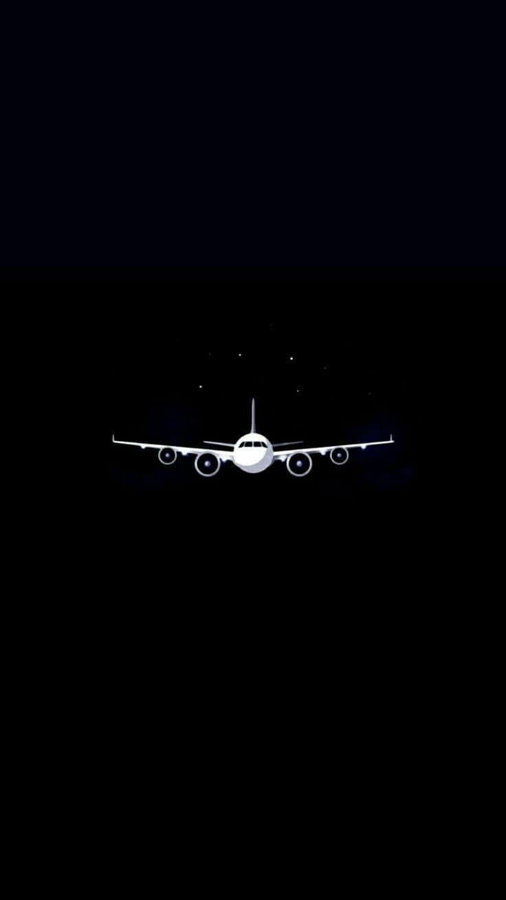 Plane 桌布 壁紙 — 一架清晰的白色飛機剪影在深邃的黑色夜空翱翔，點綴著遙遠的星星。