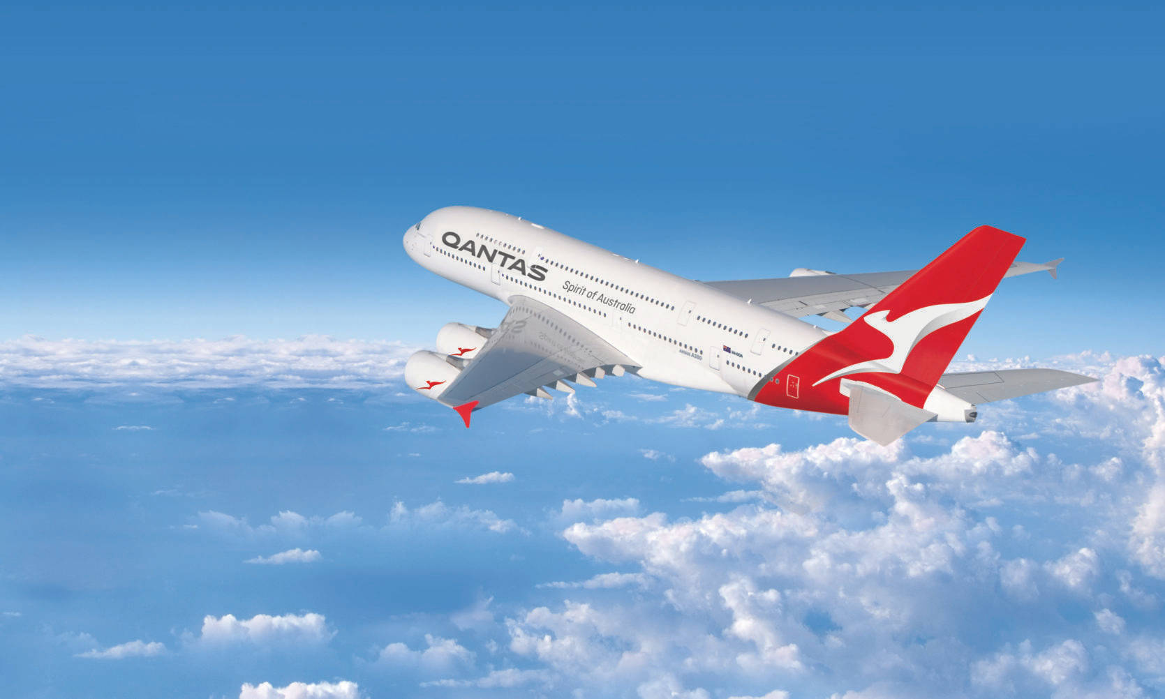 飛機 桌布 壁紙 — 一架澳洲航空空中巴士A380在晴朗藍天下翱翔於蓬鬆白雲之上。