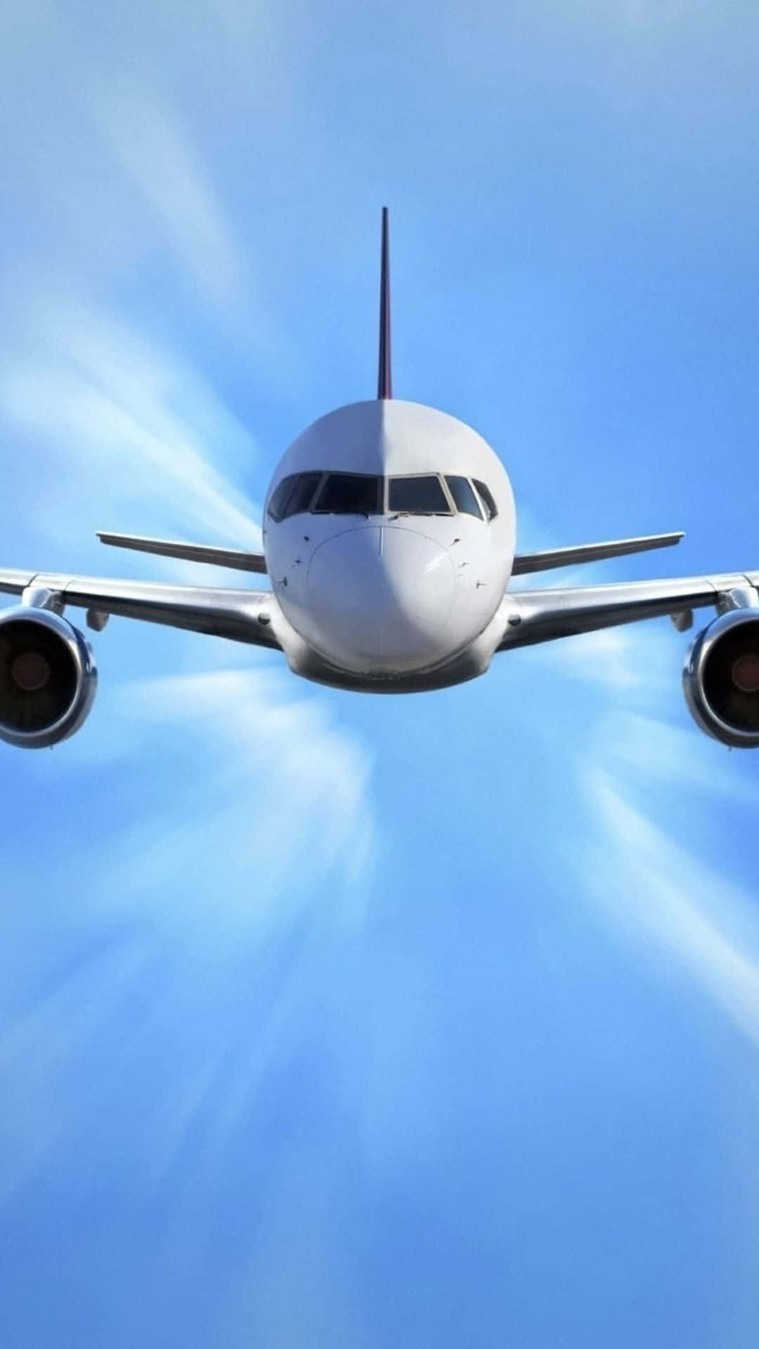 Android Small Planes 桌布 壁紙 — 一架白色客機在藍天白雲中直接向觀眾飛來。