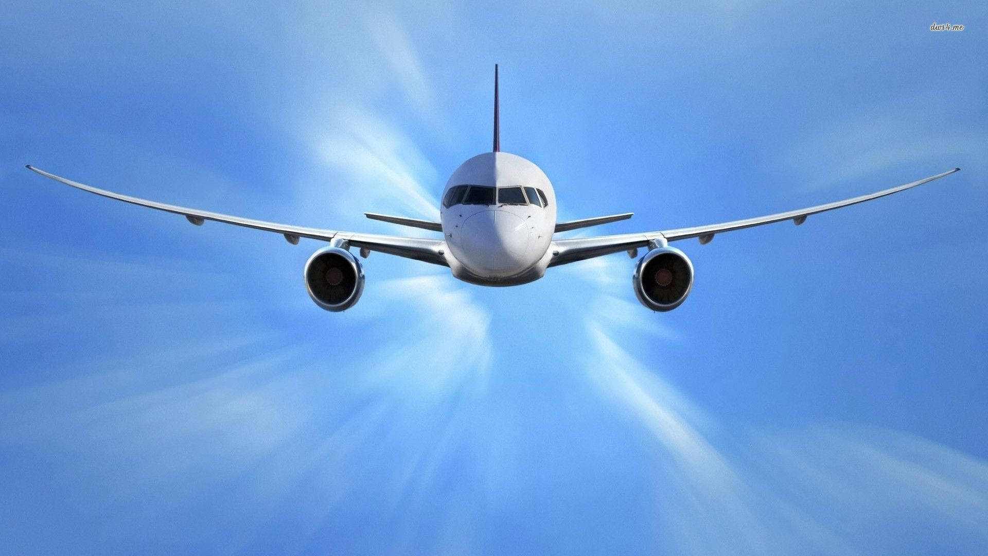 Plane 桌布 壁紙 — 一架白色客機正面衝向藍天，背後陽光四射。