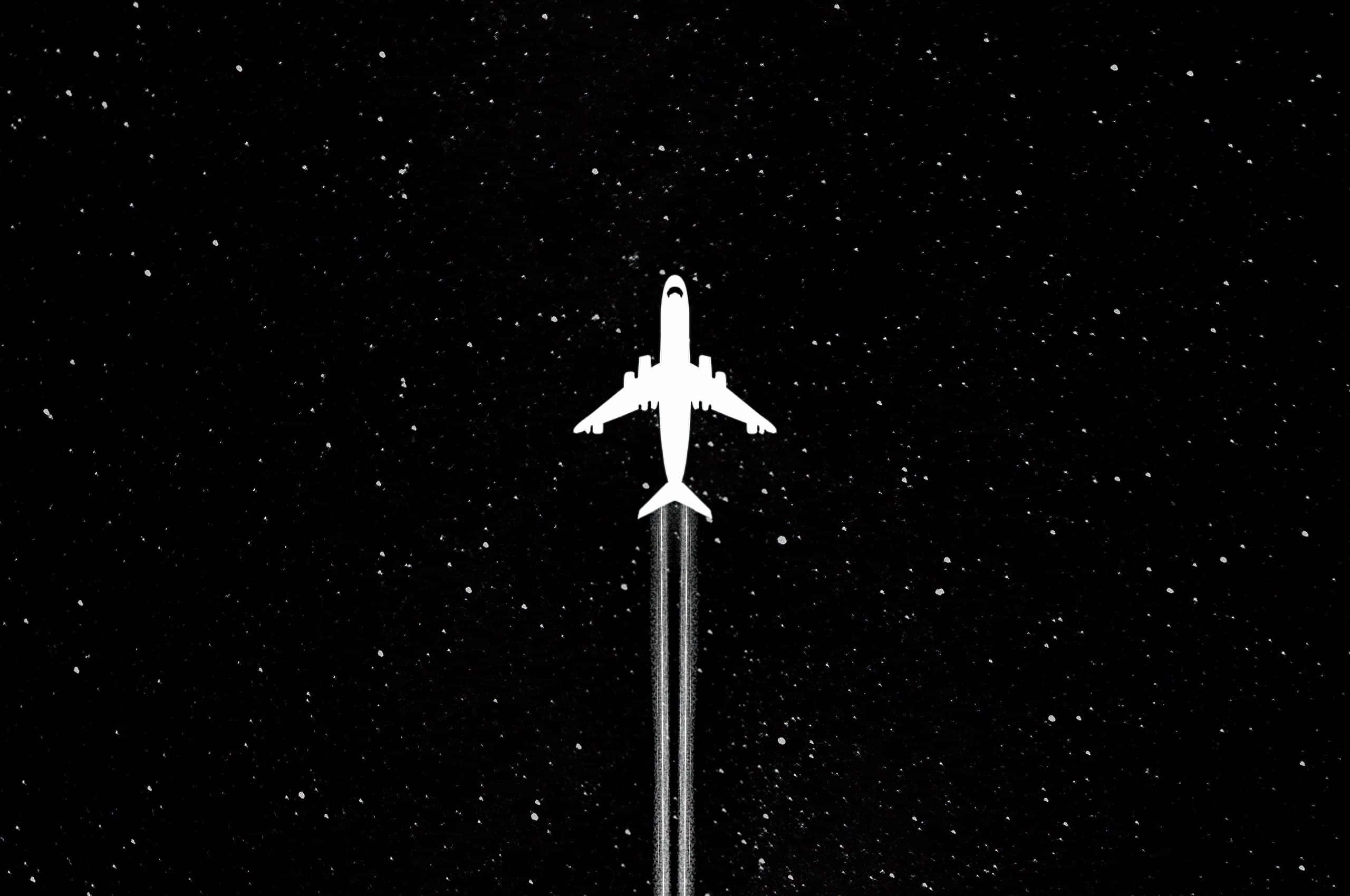 飛機 桌布 壁紙 — 一架純白色的飛機在繁星點點的夜空中翱翔，留下一道發光的凝結尾跡。