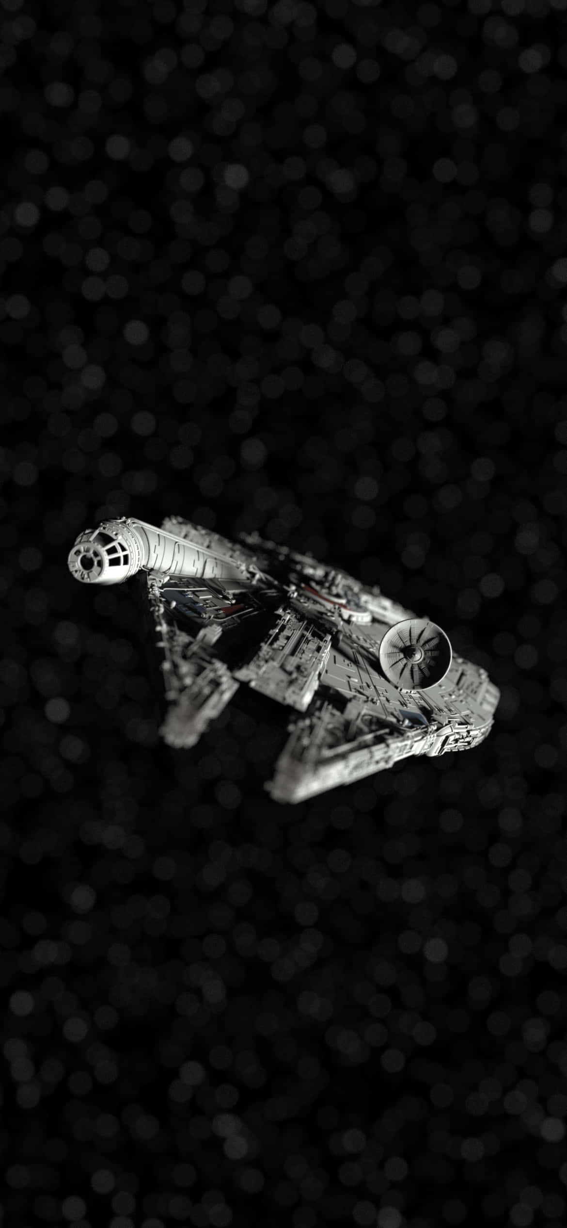 桌布 壁紙 — 一架細節豐富的單色千年鷹號太空船在散景背景的星空中滑行。