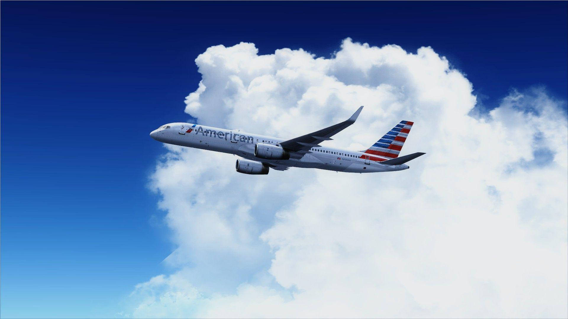 Airlines 桌布 壁紙 — 一架美國航空噴射機在機翼下飄浮著蓬鬆白雲的鮮豔藍天中翱翔。