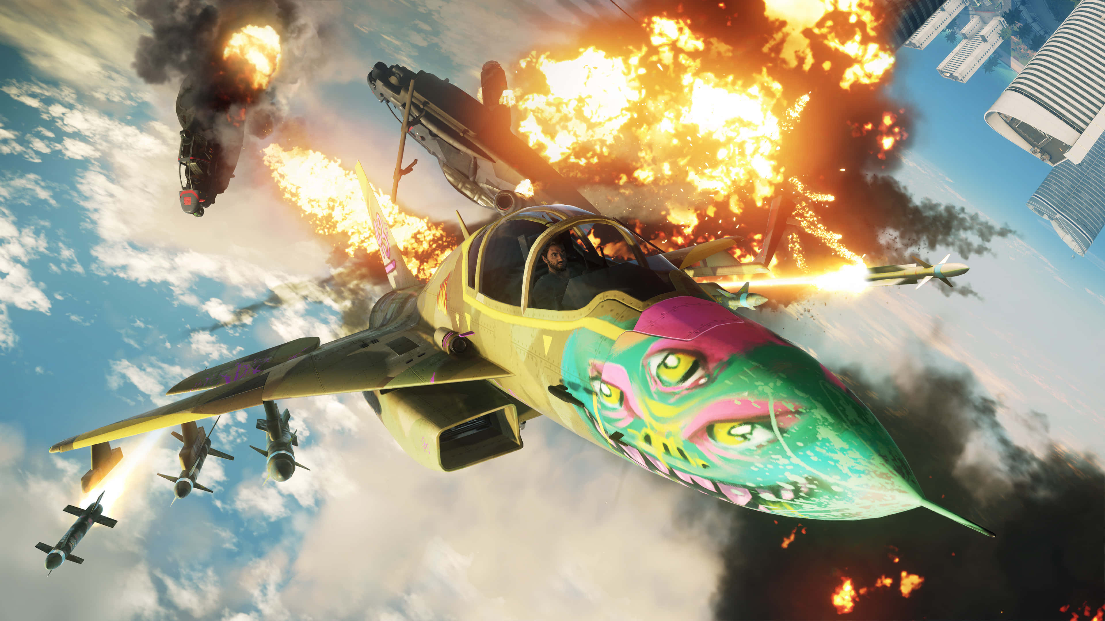 HD Just Cause 4 桌布 壁紙 — 一架色彩鮮豔的戰鬥機在充滿爆炸和煙霧的天空中翱翔，在未來城市附近進行空戰。