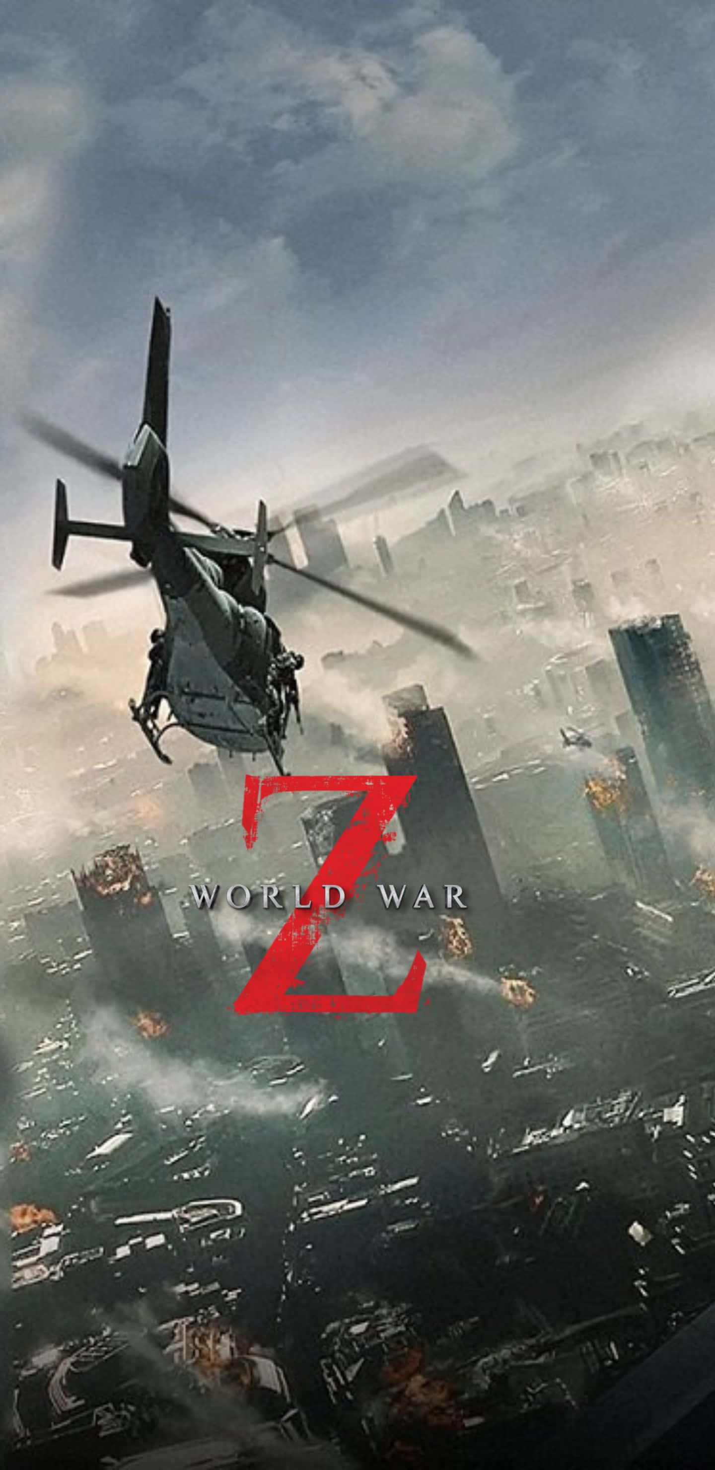 Pixel 3xl World War Z 桌布 壁紙 — 一架軍用直升機飛越廢墟般的城市景觀，在暴風雨的天空下，倒塌的摩天大樓中爆發爆炸。