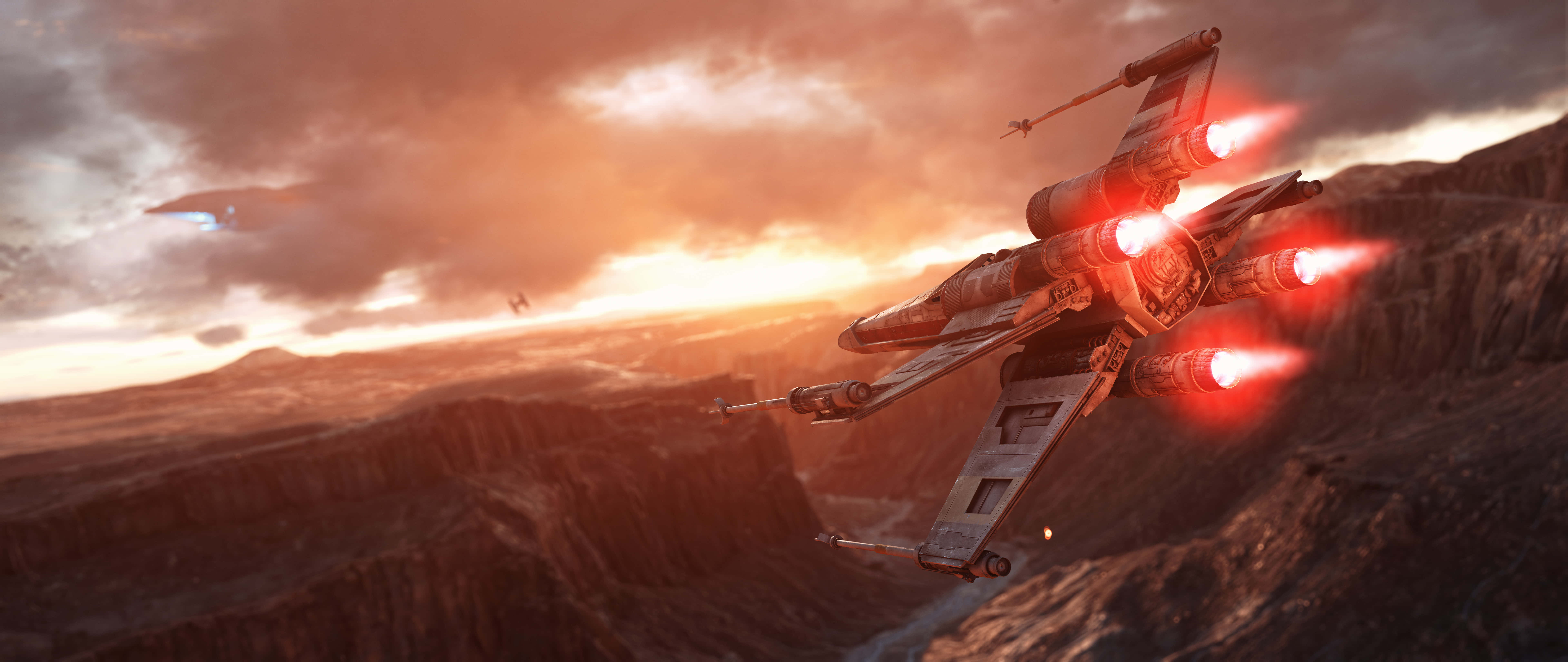 Star Wars X Wing 桌布 壁紙 — 一架配備紅色發光引擎的星際戰機在日落時分飛越崎嶇的峽谷，將火焰般的光芒投射在岩石地形上。