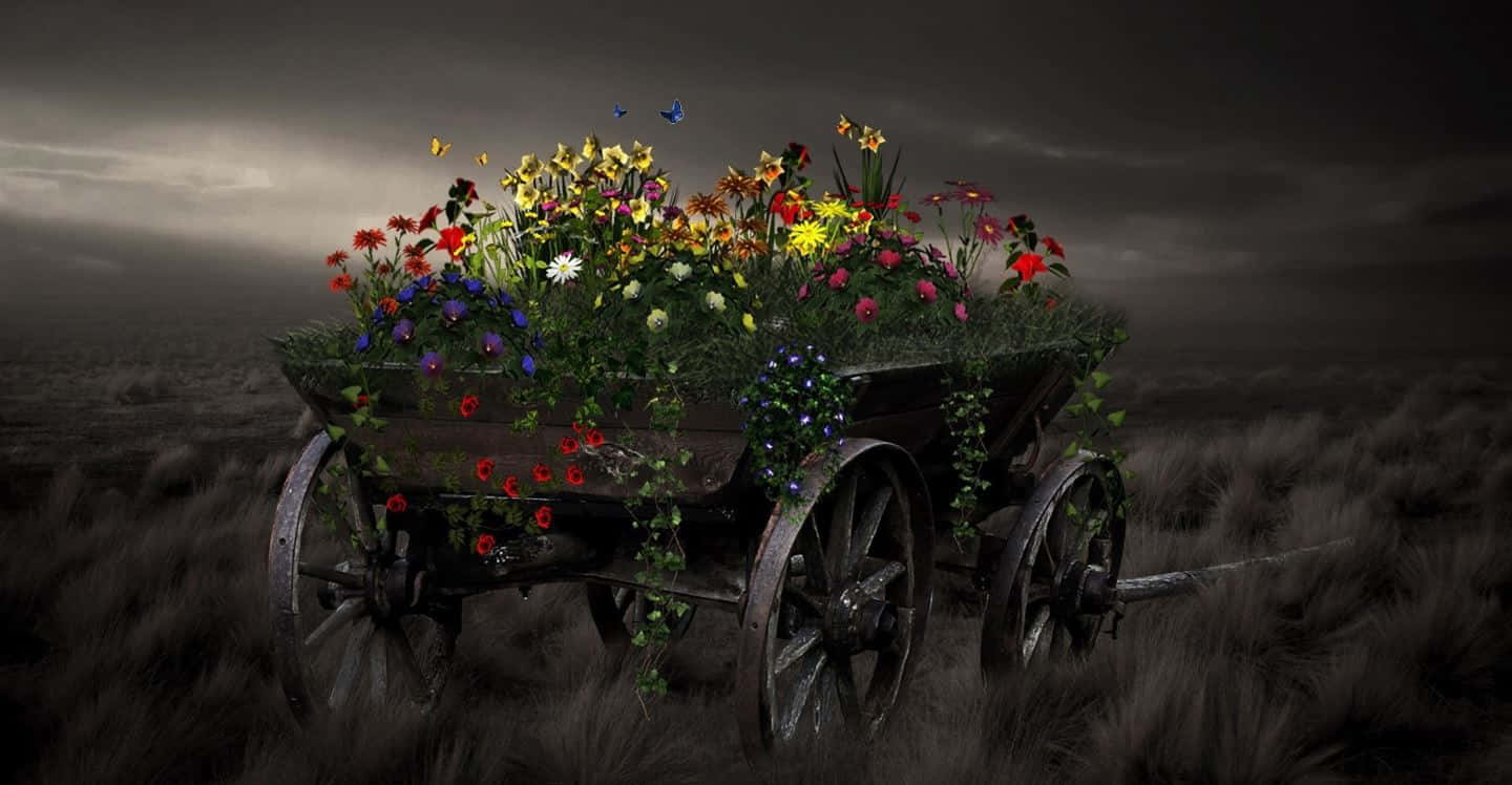 Flower Cart 桌布 壁紙 — 一架飽經風霜的木製馬車，裝滿了鮮豔的野花和翩翩起舞的蝴蝶，獨自矗立在單色田野中，天空風起雲湧。