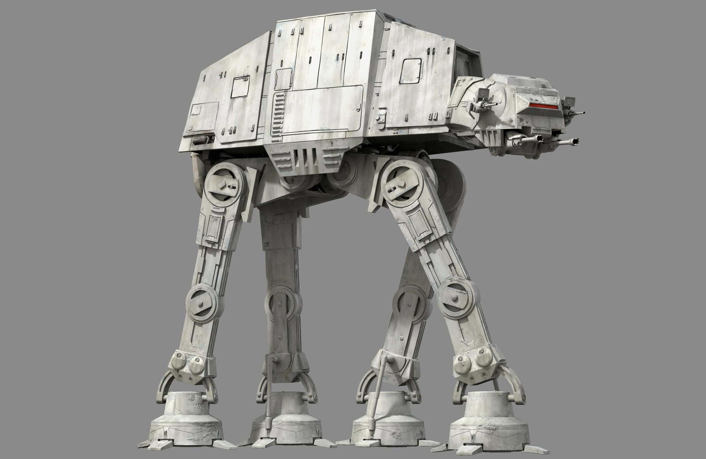 At-at 桌布 壁紙 — 一架高聳的灰色AT-AT步行機在純灰色背景前威嚴地站立，展示其巨大的機械腿和裝甲機身。