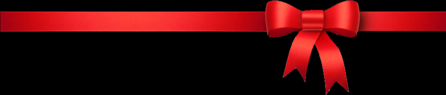 Red Ribbon 桌布 壁紙 — 一條亮面紅色緞帶蝴蝶結，襯在純黑色背景上。
