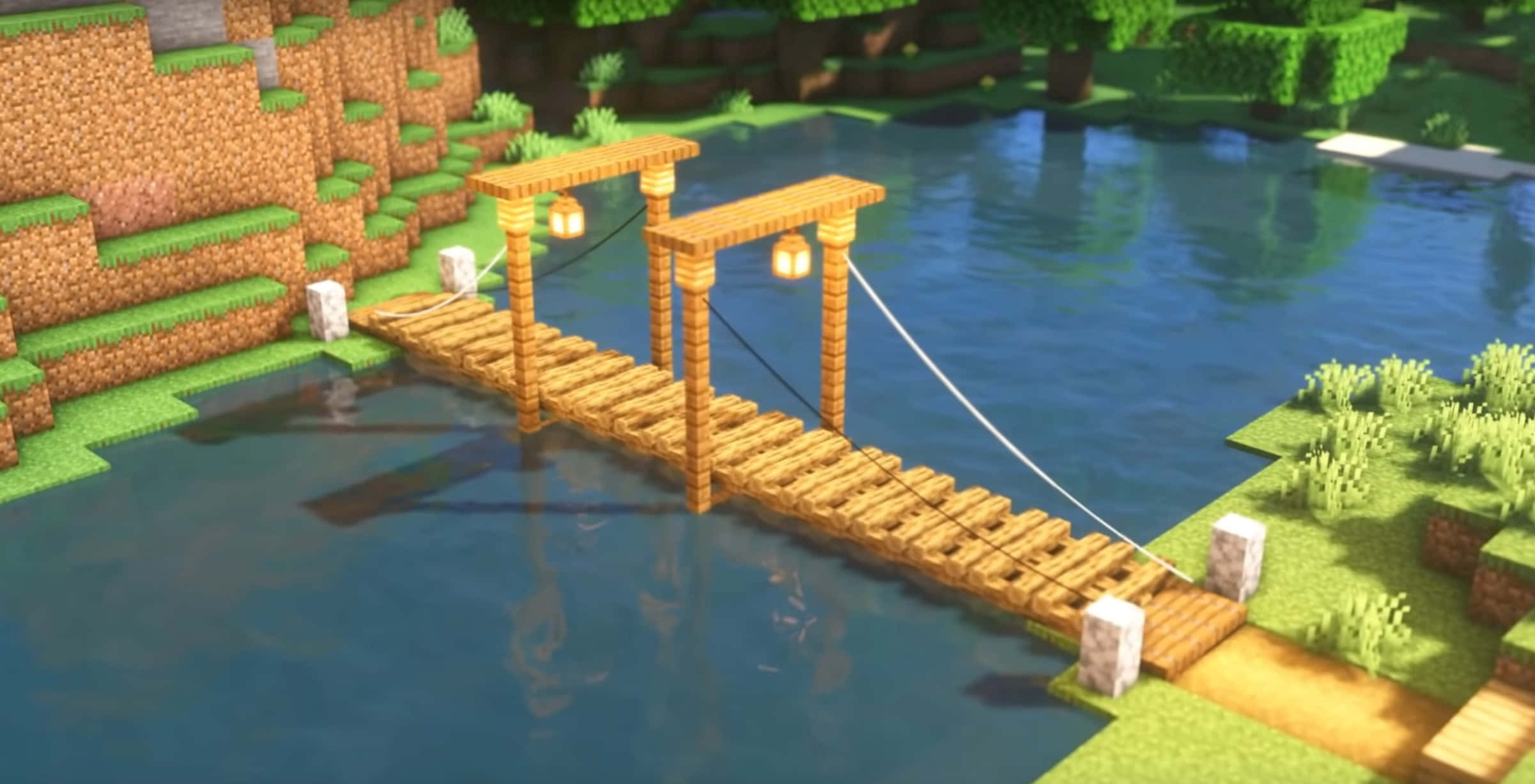Minecraft Bridges 桌布 壁紙 — 一條像素化的木製吊橋掛著燈籠，橫跨在平靜的藍色河流上，處於方塊狀的Minecraft景觀中。