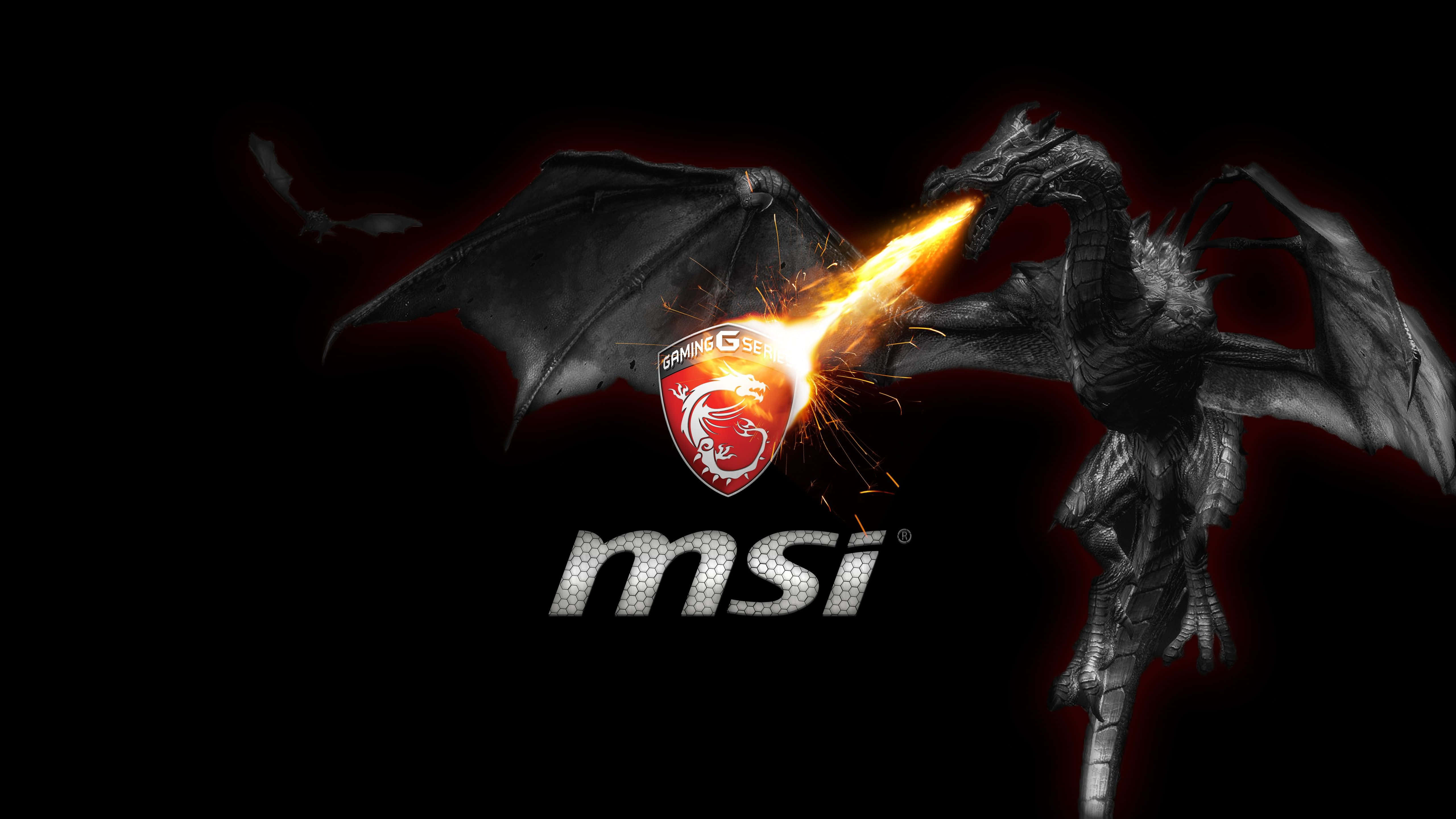 微星 桌布 壁紙 — 一條兇猛的黑龍直接向黑暗背景上的MSI Gaming標誌噴出熾熱的橙色火焰。