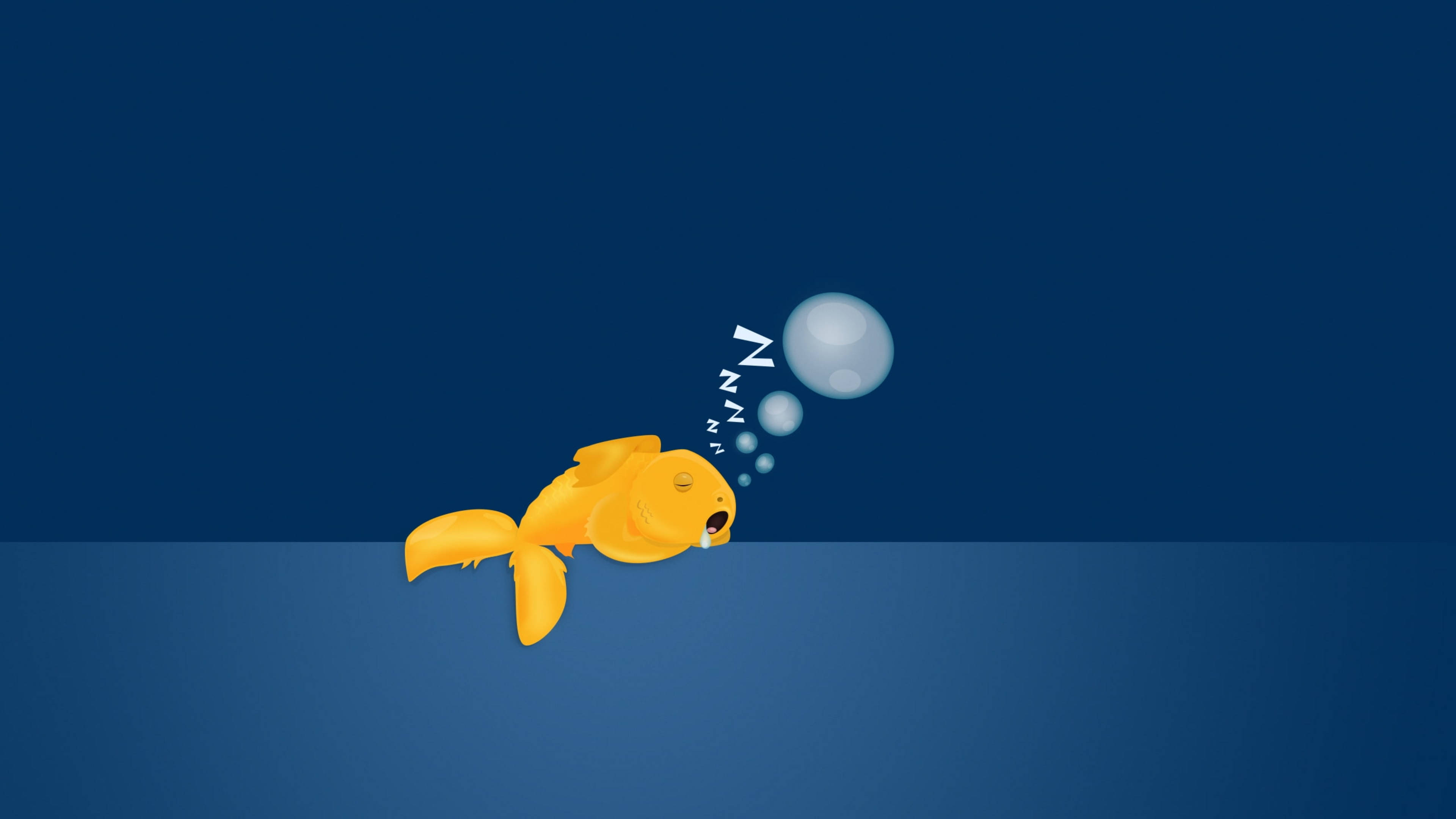 Goldfish 桌布 壁紙 — 一條卡通金魚在水底平靜地睡覺，呼出帶有「Zzz」標記的氣泡，背景是深藍色漸變。