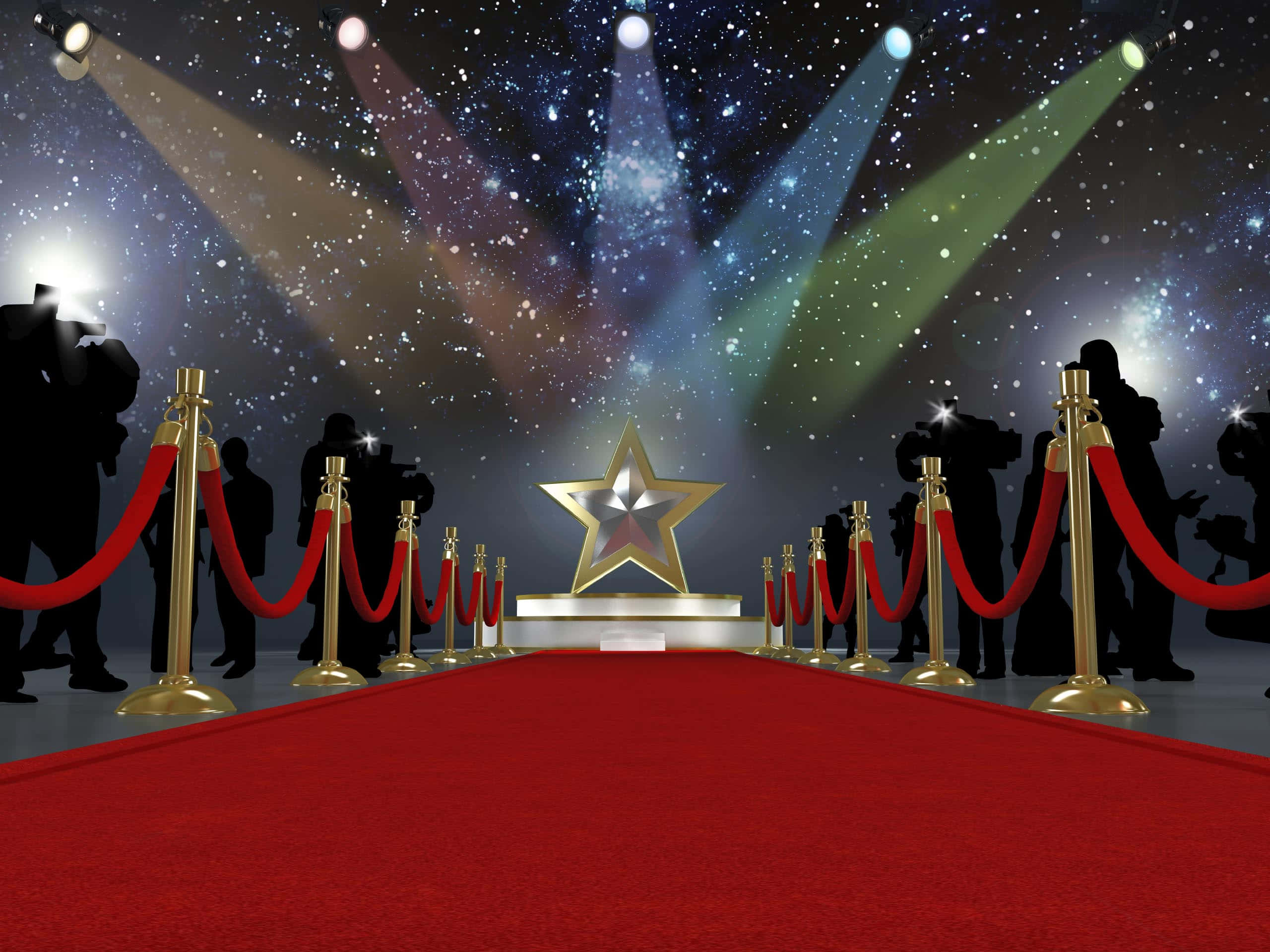 Red Carpet 桌布 壁紙 — 一條宏偉的紅地毯在星空和彩色聚光燈下通向一顆閃閃發光的金色星星，還有剪影攝影師。