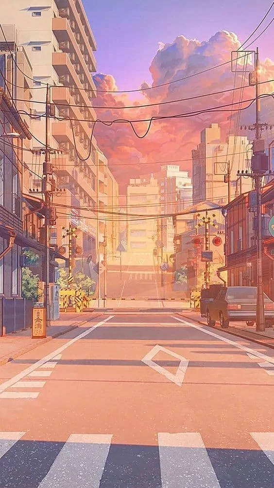 Trendy Aesthetic 桌布 壁紙 — 一條寧靜的動漫風格城市街道，沐浴在溫暖的日落色調中，帶有粉彩雲和安靜的建築。