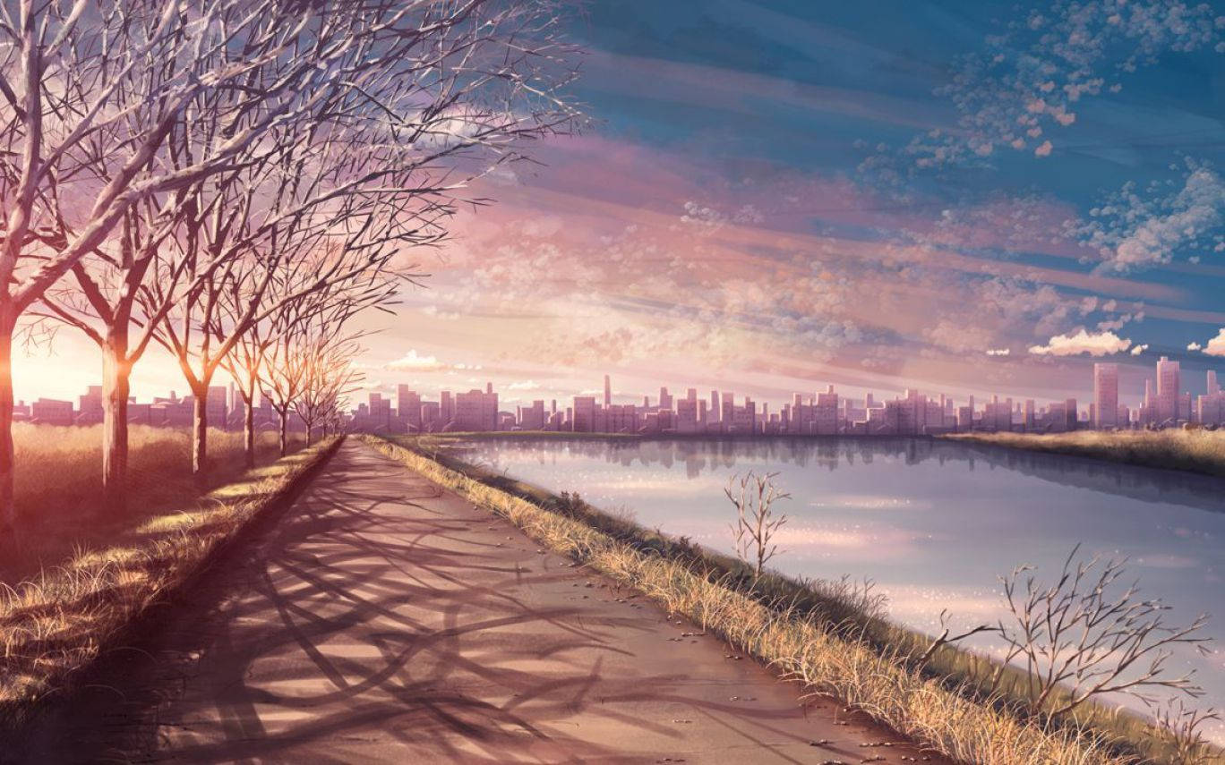 動畫風景 桌布 壁紙 — 一條寧靜的日落小徑，兩旁是光禿禿的樹木，通向遠處城市天際線，倒映在平靜的水面上。