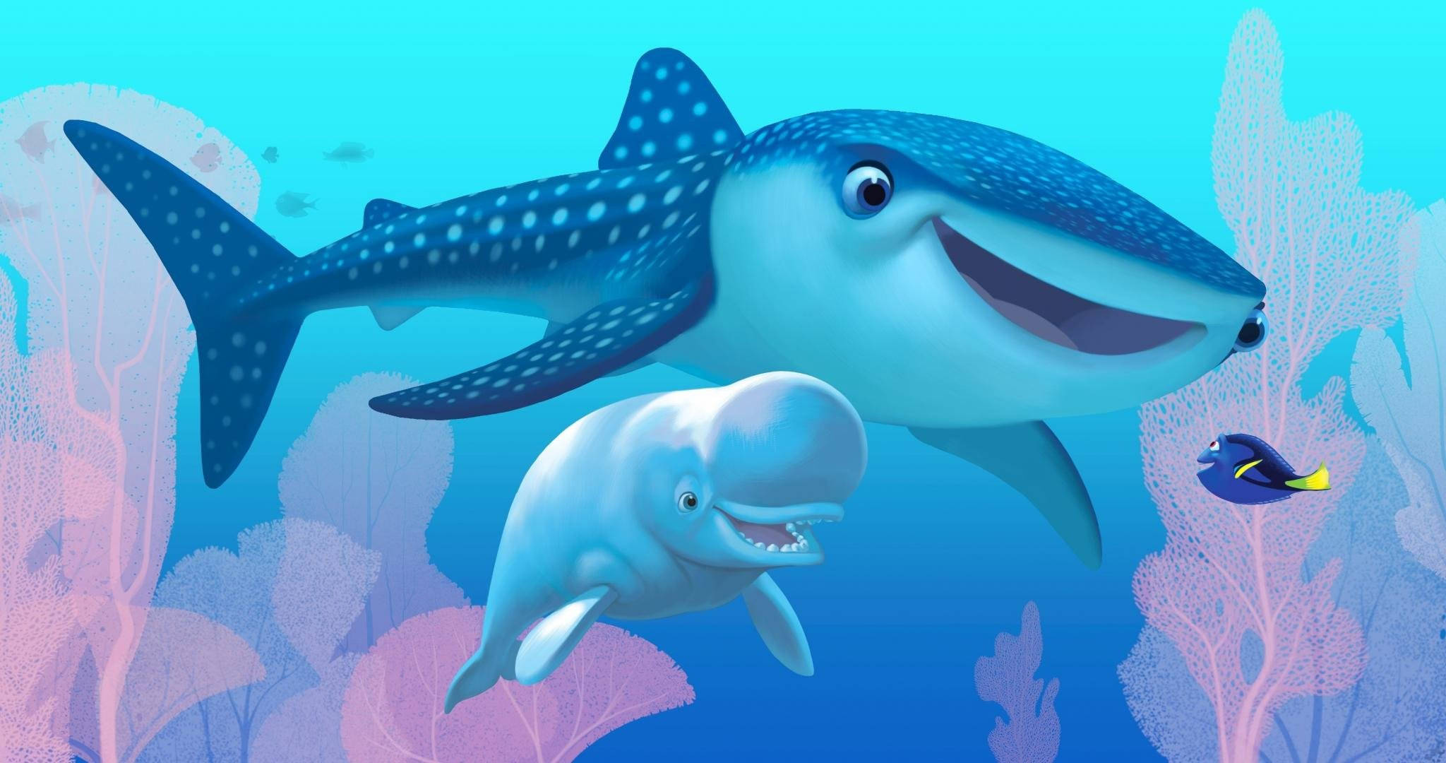 Dory 桌布 壁紙 — 一條快樂的卡通鯨魚和鯨魚寶寶游過粉紅色珊瑚，旁邊有一條小魚，在充滿活力的藍色海洋中。