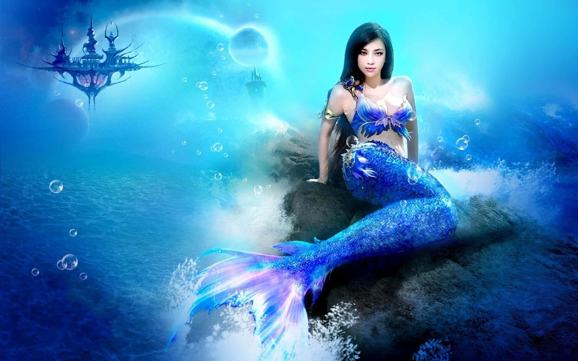 美人魚 桌布 壁紙 — 一條擁有閃爍藍色尾巴的美人魚優雅地坐在水下岩石上，而空靈的漂浮城堡在遠處發光。