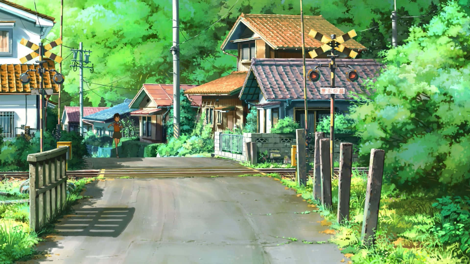 一條有房屋和火車的街道 壁紙