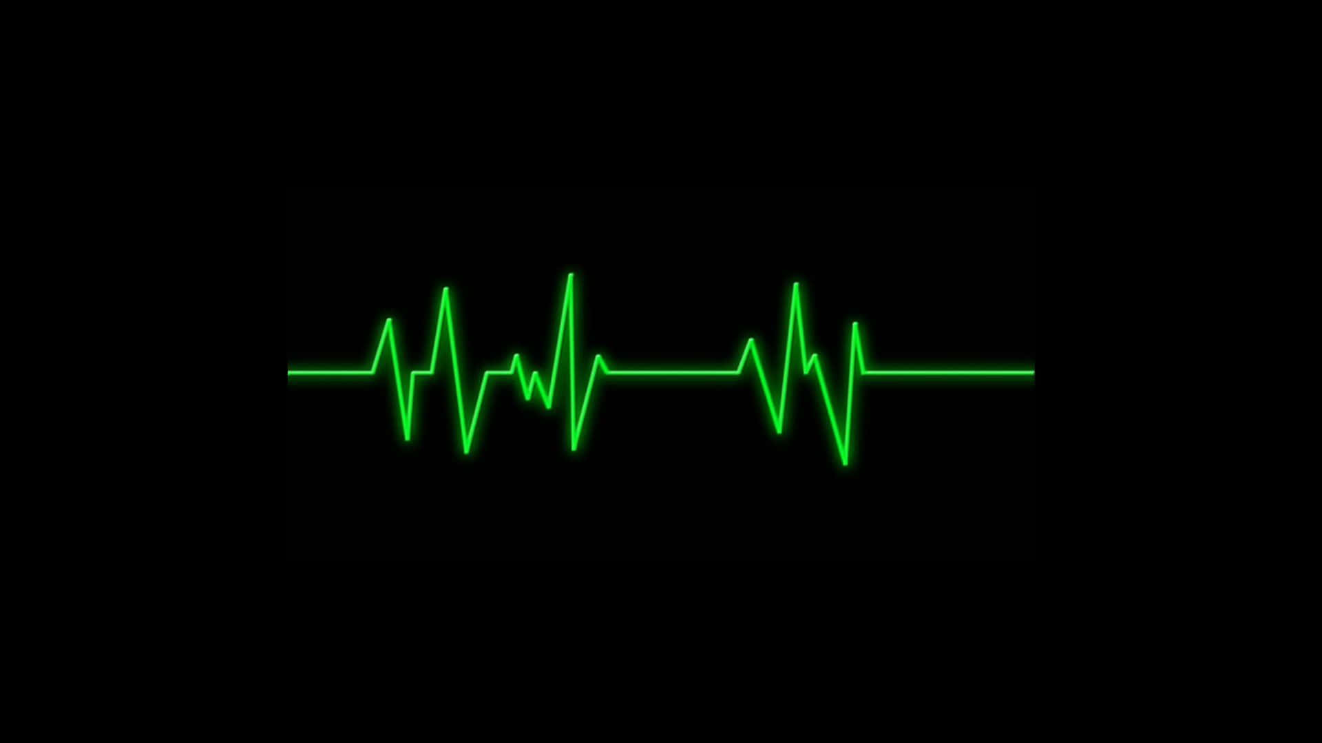 Heart Rate 桌布 壁紙 — 一條發光的綠色心跳線在純黑色背景上穩定地脈動。