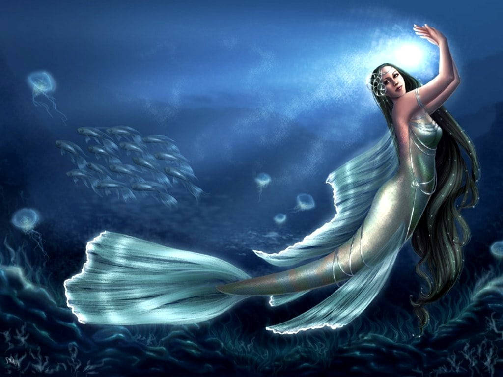 Beautiful Fish 桌布 壁紙 — 一條發光的美人魚，擁有流動的銀色尾巴，在深藍色的海洋水域中滑行，周圍環繞著魚群和發光的水母。