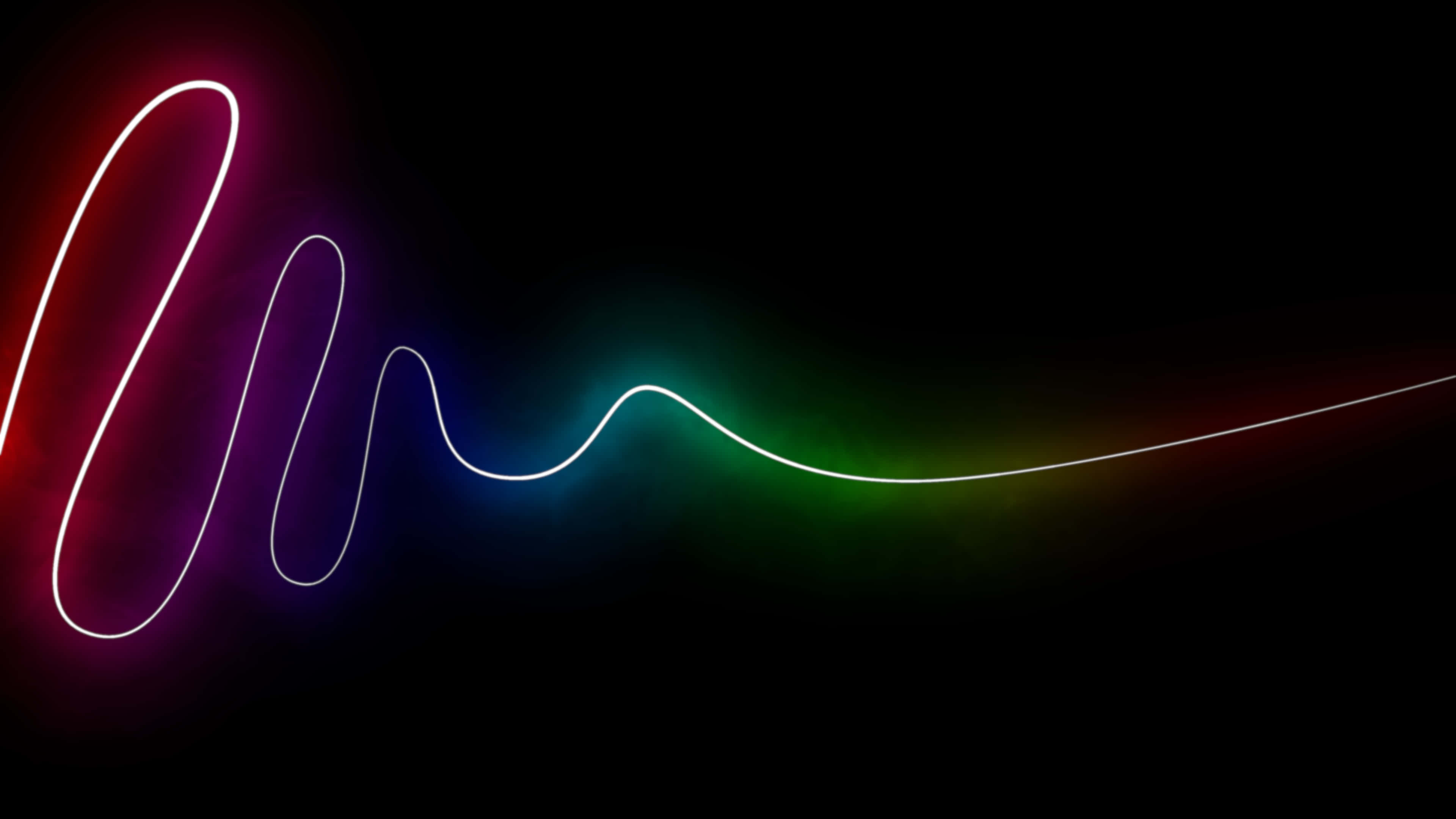 RGB 桌布 壁紙 — 一條發光的霓虹燈光軌跡在黑色背景上劃出弧線，從紅色漸變到綠色，帶有柔和的光暈。