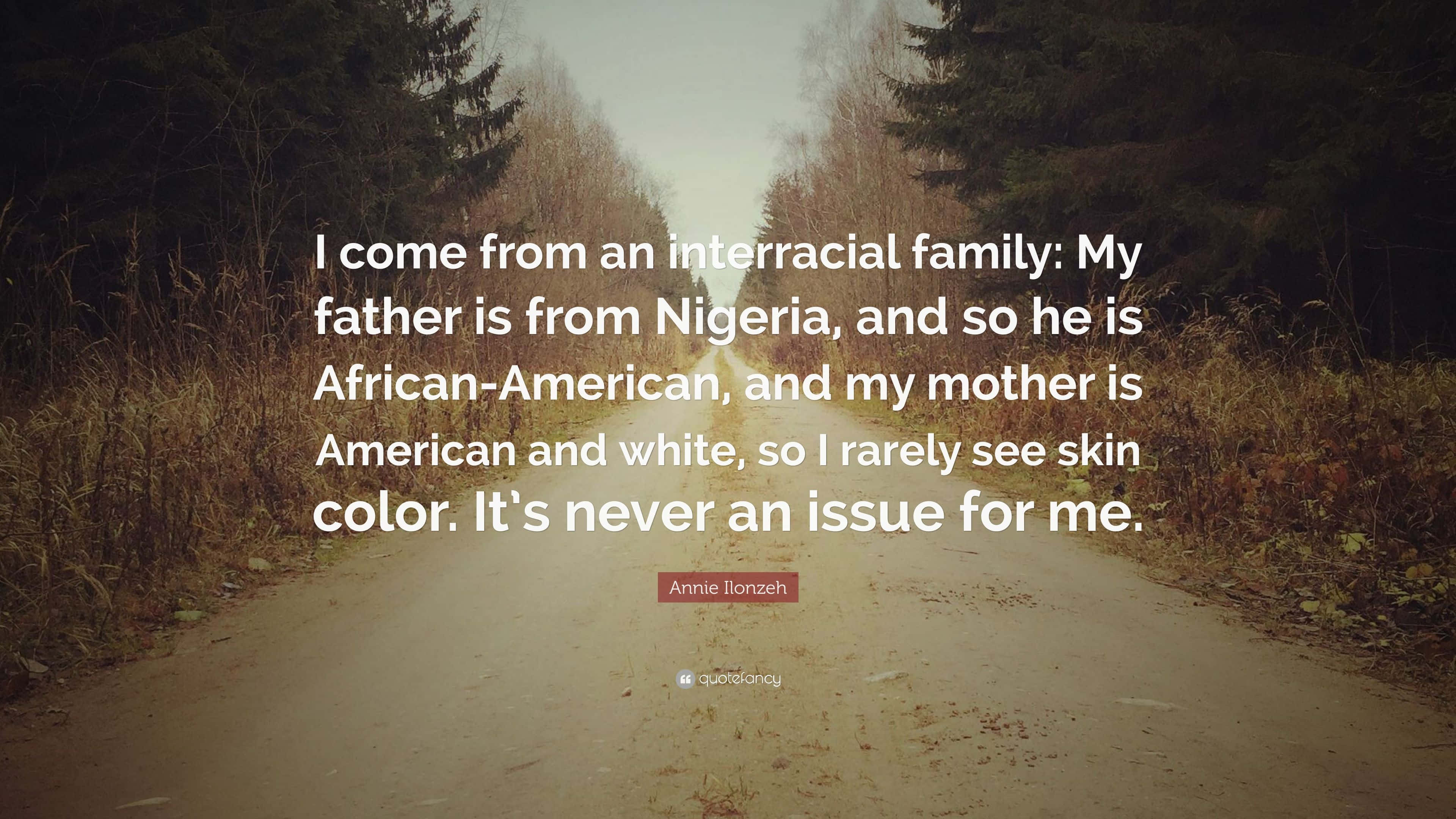 Interracial 桌布 壁紙 — 一條蜿蜒的泥土路穿過秋日樹林，並帶有跨種族家庭身份的引言覆蓋層。