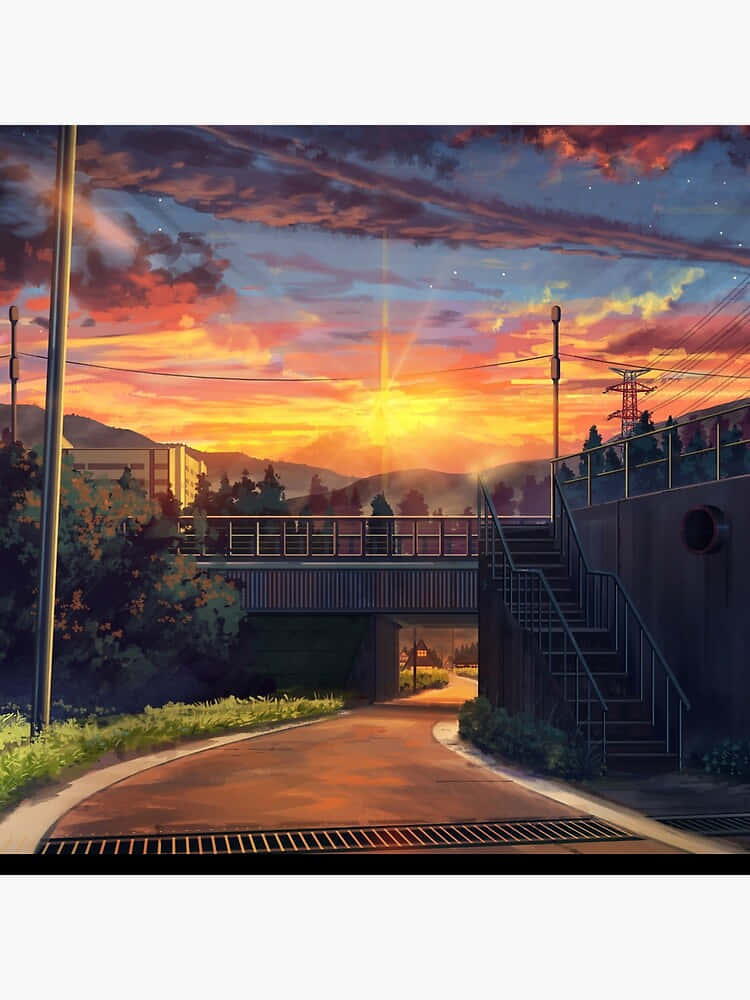 桌布 壁紙 — 一條蜿蜒的道路在日落時分在鐵路橋下彎曲，遠處山巒上方有火橙色和紫色的雲彩。
