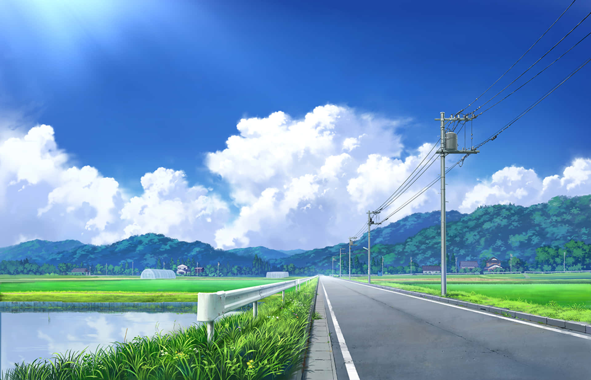 風景 桌布 壁紙 — 一條蜿蜒的道路穿過充滿活力的綠色稻田，上方是明亮的藍天和蓬鬆的白雲。