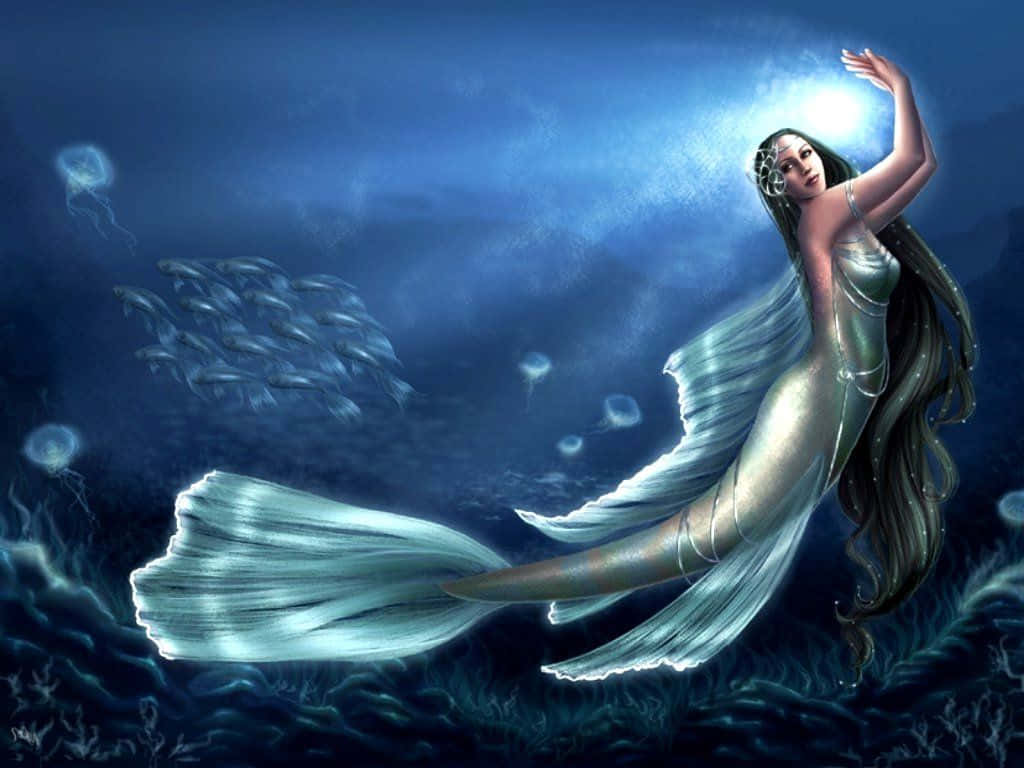 美人魚 桌布 壁紙 — 一條閃亮的美人魚，擁有流動的銀色尾巴，在深藍色的海洋中滑行，周圍環繞著發光的水母和魚群。