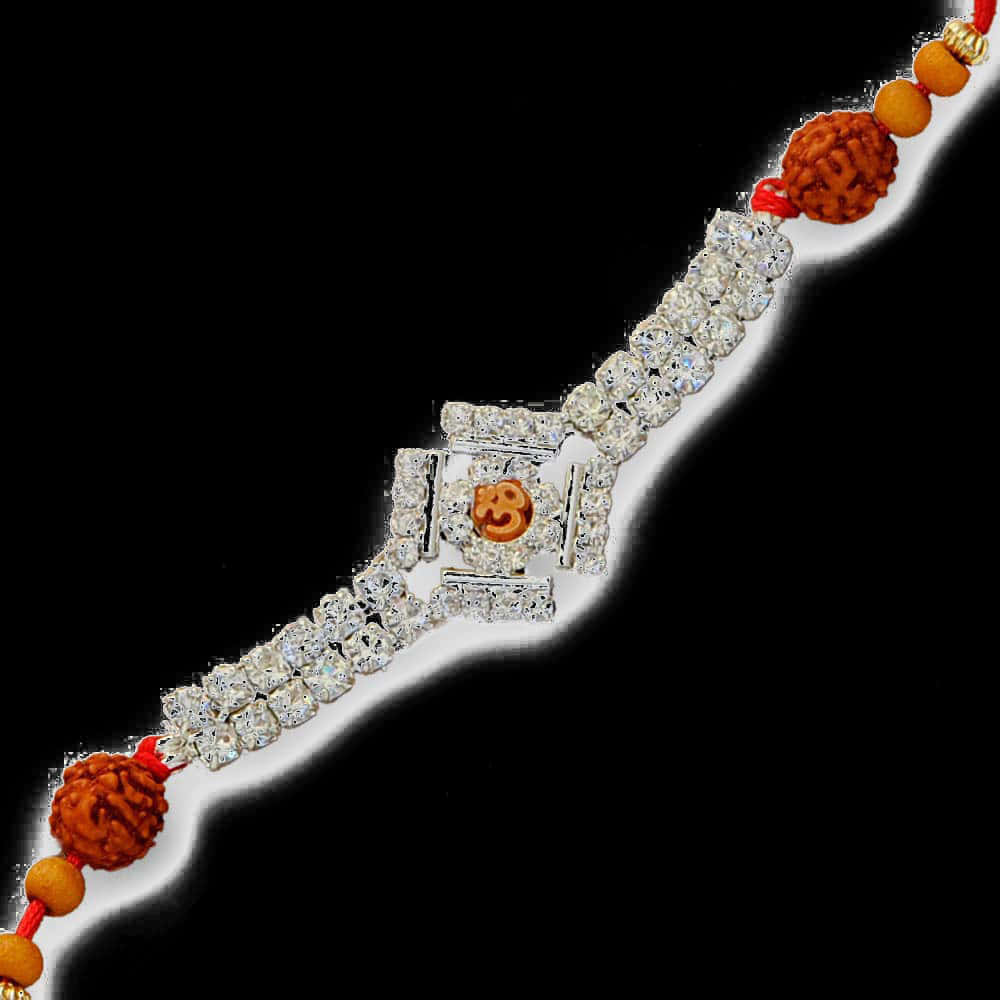 Bracelet 桌布 壁紙 — 一條閃閃發光、鑲有鑽石的Rakhi手鐲，帶有橙色Om符號和Rudraksha珠子，紅色線，黑色背景。
