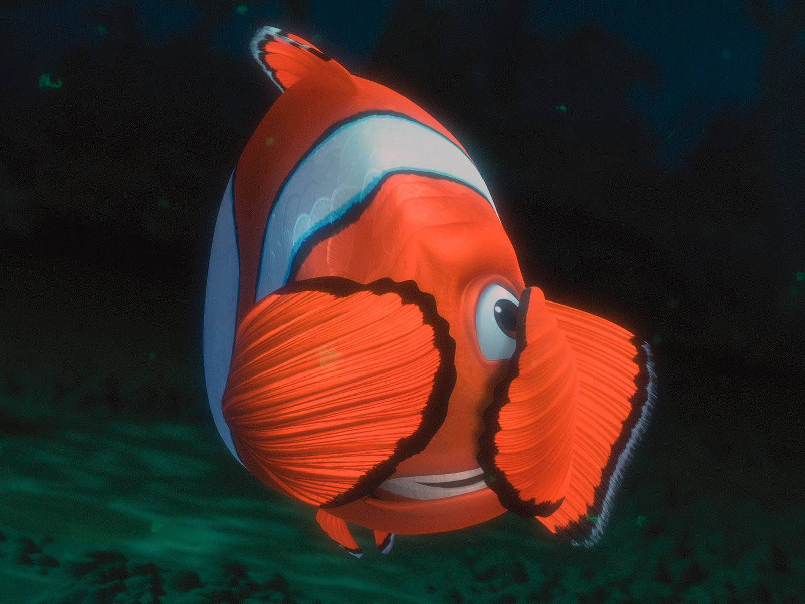 nemo 桌布 壁紙 — 一條鮮豔的橙色小丑魚帶有白色條紋，優雅地在深藍色海水中游動。