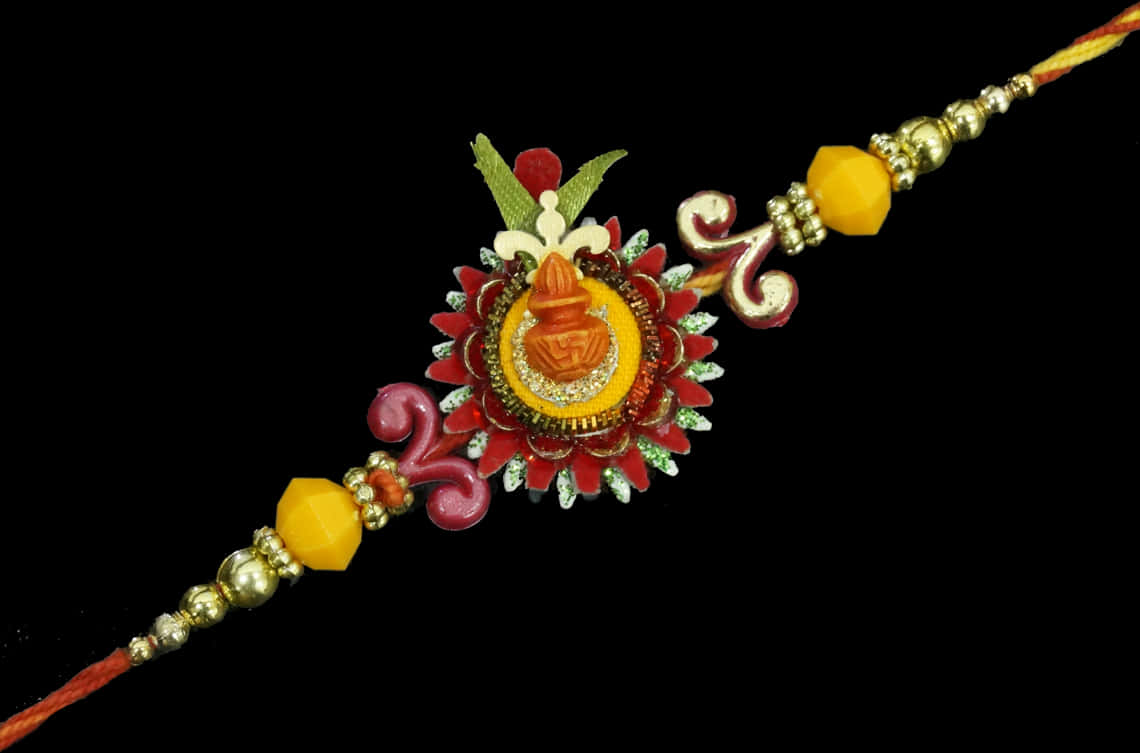 Bracelet 桌布 壁紙 — 一條鮮豔精緻的Rakhi，飾有紅色、黃色和金色珠子，中央有一個華麗的吊墜，背景為黑色。