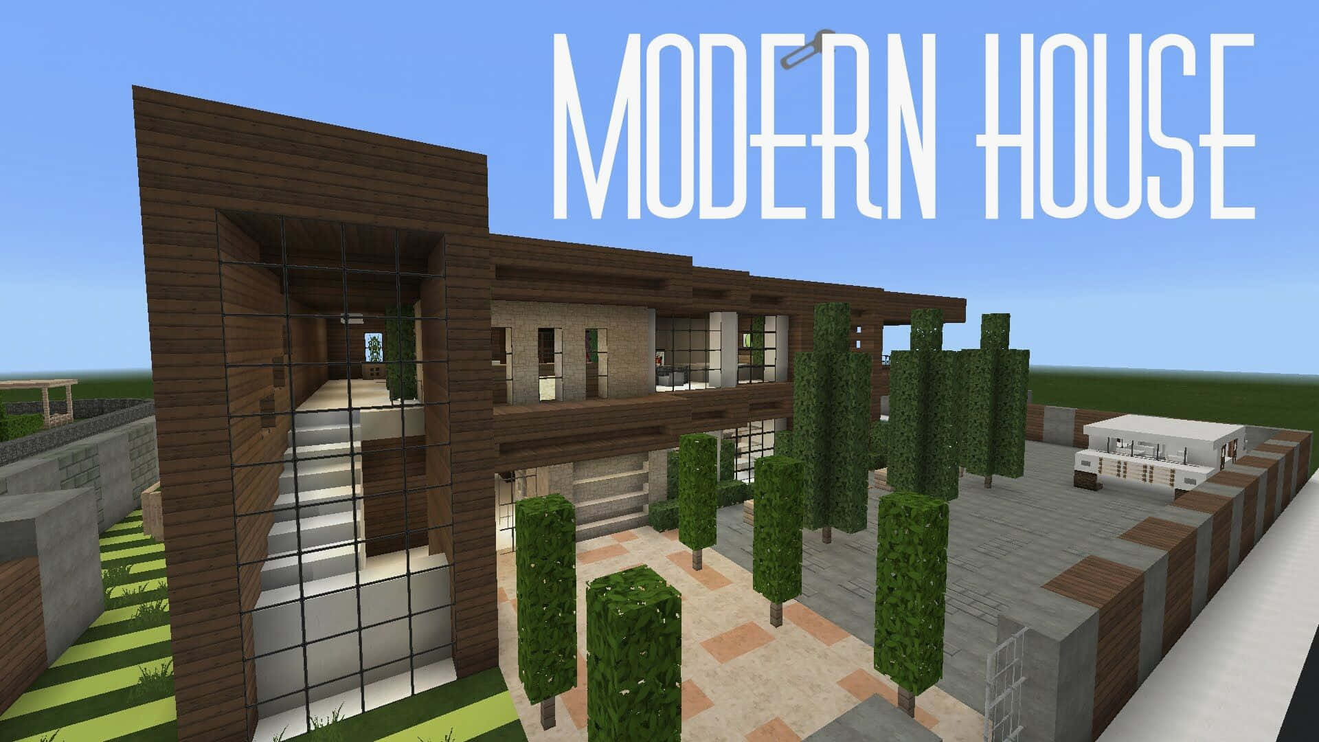 Minecraft Houses 桌布 壁紙 — 一棟現代住宅，採用木質面板、玻璃牆和石材點綴，周圍環繞著修剪整齊的樹籬，在清澈的藍天下。