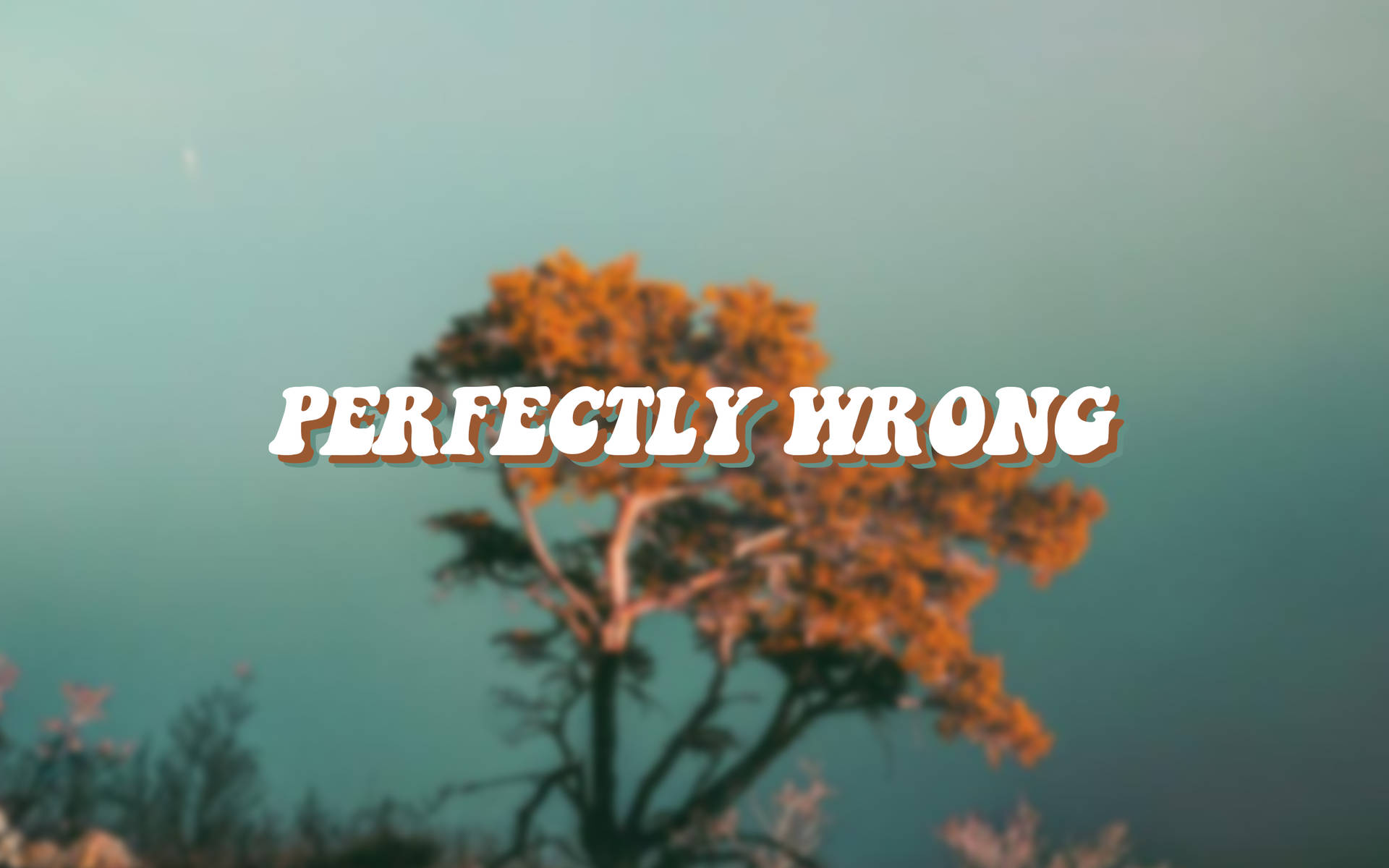 一棵風格化的樹，帶有橙色葉子和粗體文字，寫著 perfectly wrong，背景為青綠色。 — 復古美學 GIF 壁紙