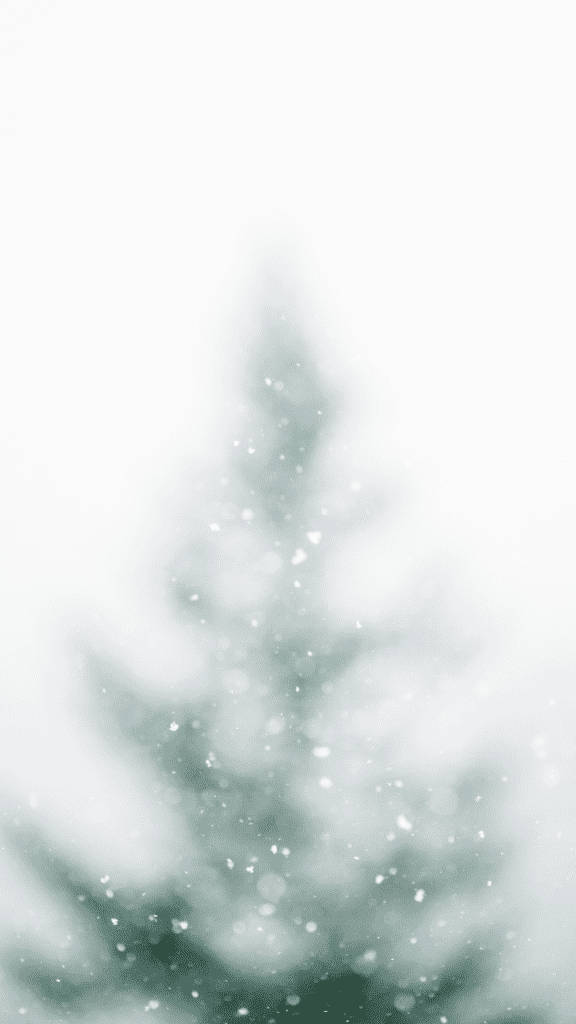 一棵被雪覆蓋的常青樹在冬日風景中，雪花飄落。 — 簡約美學 壁紙