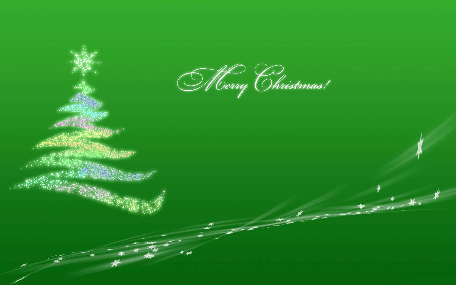Dark Green Christmas 桌布 壁紙 — 一棵閃閃發光的彩虹色聖誕樹，頂部有星星裝飾，在充滿活力的綠色漸變背景上閃耀，帶有流動的星星軌跡和草書「聖誕快樂！」文字。