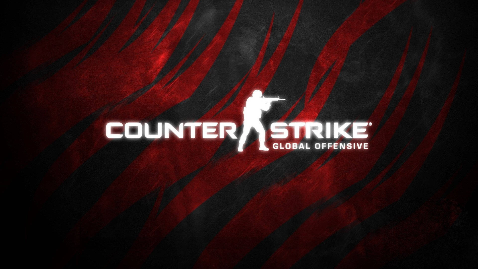 Cs Go 桌布 壁紙 — 一款大膽的紅黑條紋桌布，上面有Counter Strike Global Offensive標誌和白色士兵剪影。