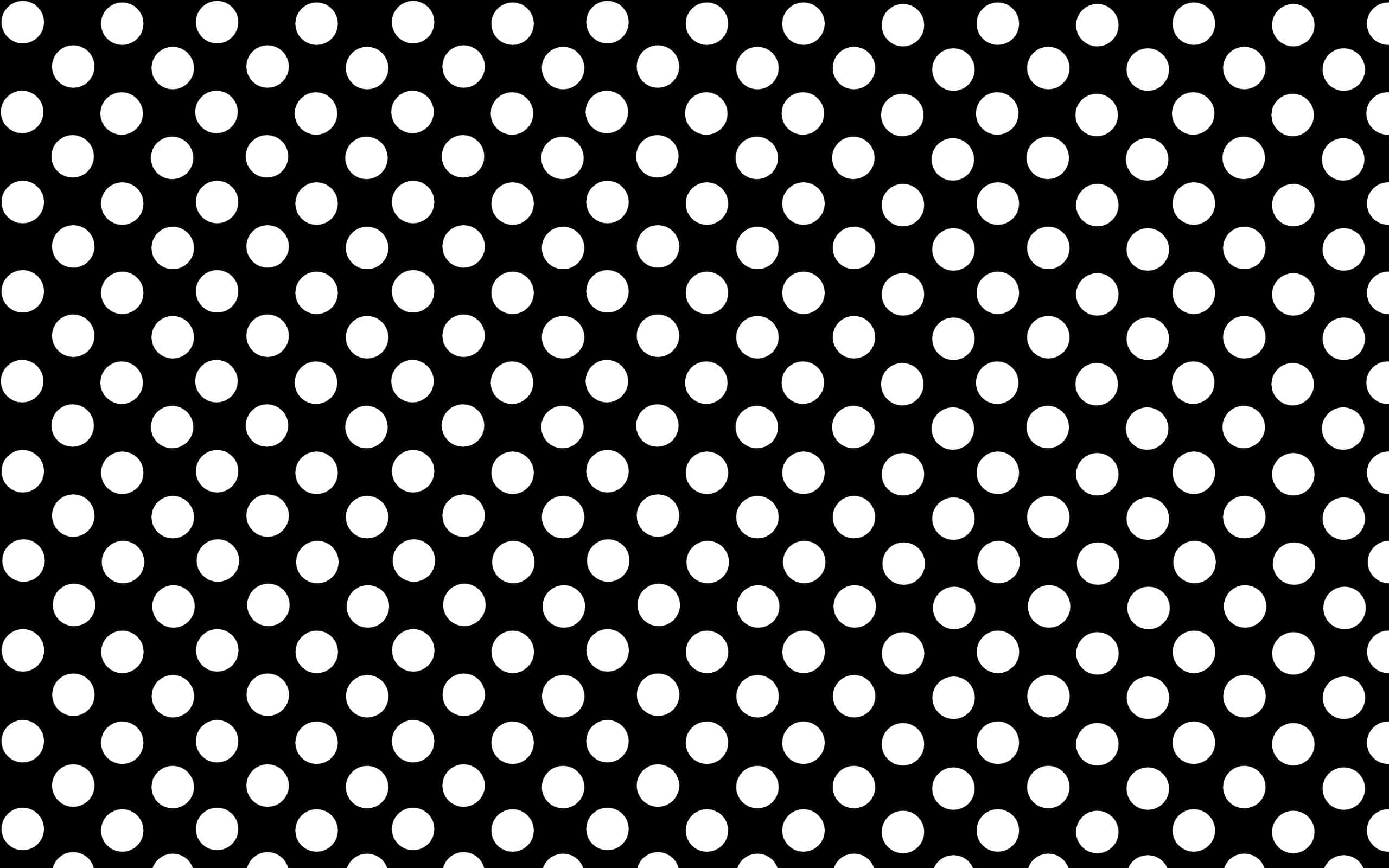Black Polka Dot 桌布 壁紙 — 一款大膽的黑白壁紙，採用均勻間隔的圓形重複圖案，營造出動態的對角線視覺節奏。